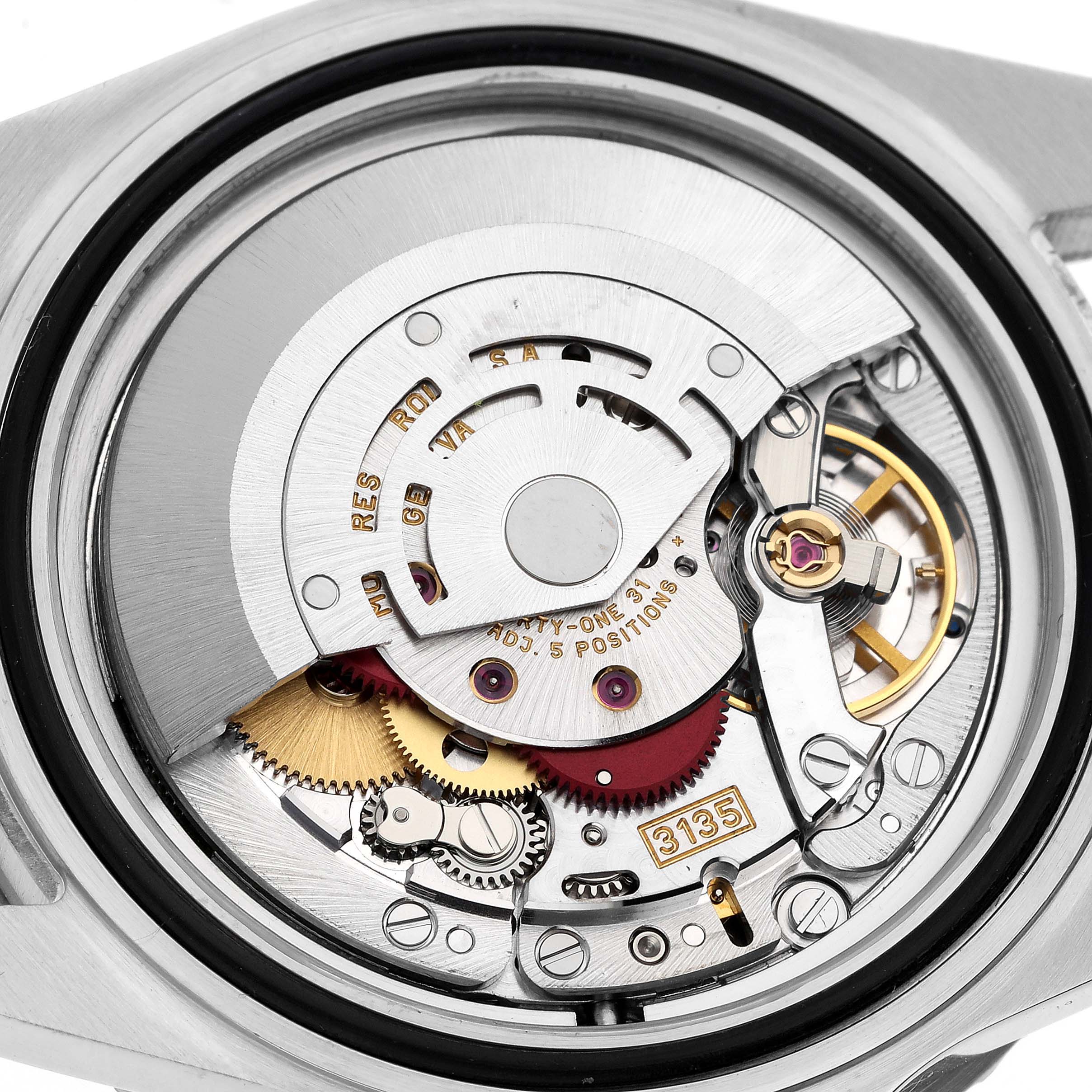 This close-up shot shows the intricate inner mechanism of a Rolex Submariner 16610 Men
s Stainless Steel Black Dial 16610 Men
s Stainless Steel Black Dial watch.