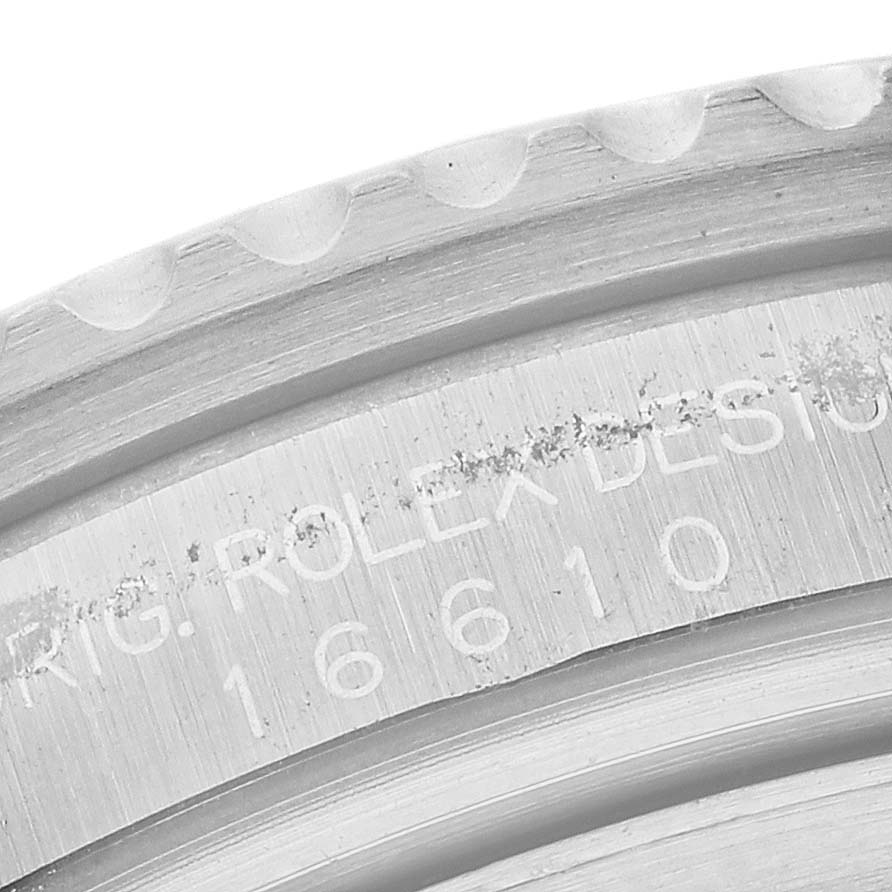 The image shows a close-up of the case edge with model engraving of a Rolex Submariner 16610 Men
s Stainless Steel Black Dial 16610 Men
s Stainless Steel Black Dial.