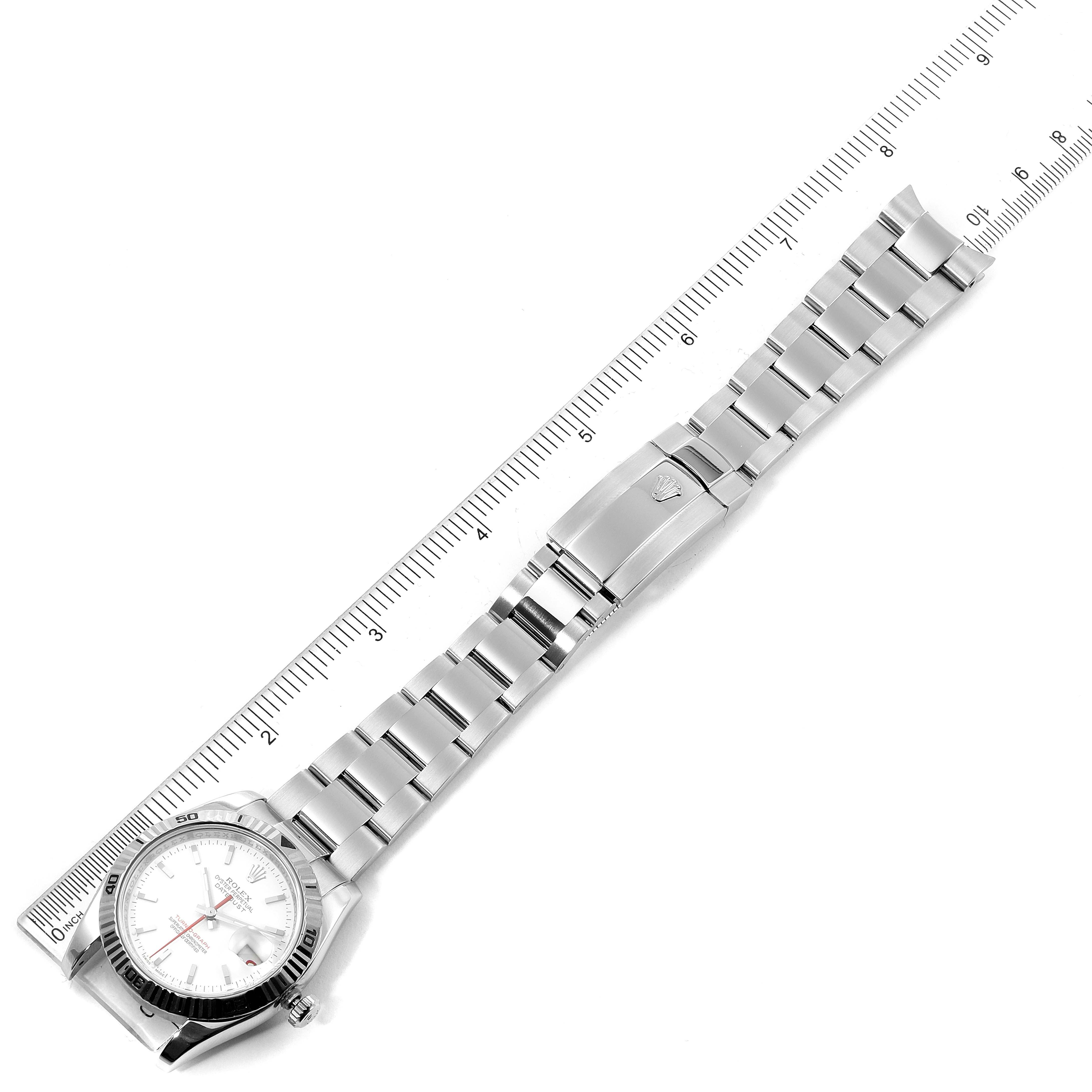 The image shows a Rolex Turn-o-Graph 116264 Men
s Stainless Steel White Dial 116264 Men
s Stainless Steel White Dial watch laid flat with an extended metal bracelet and a ruler for measurement.