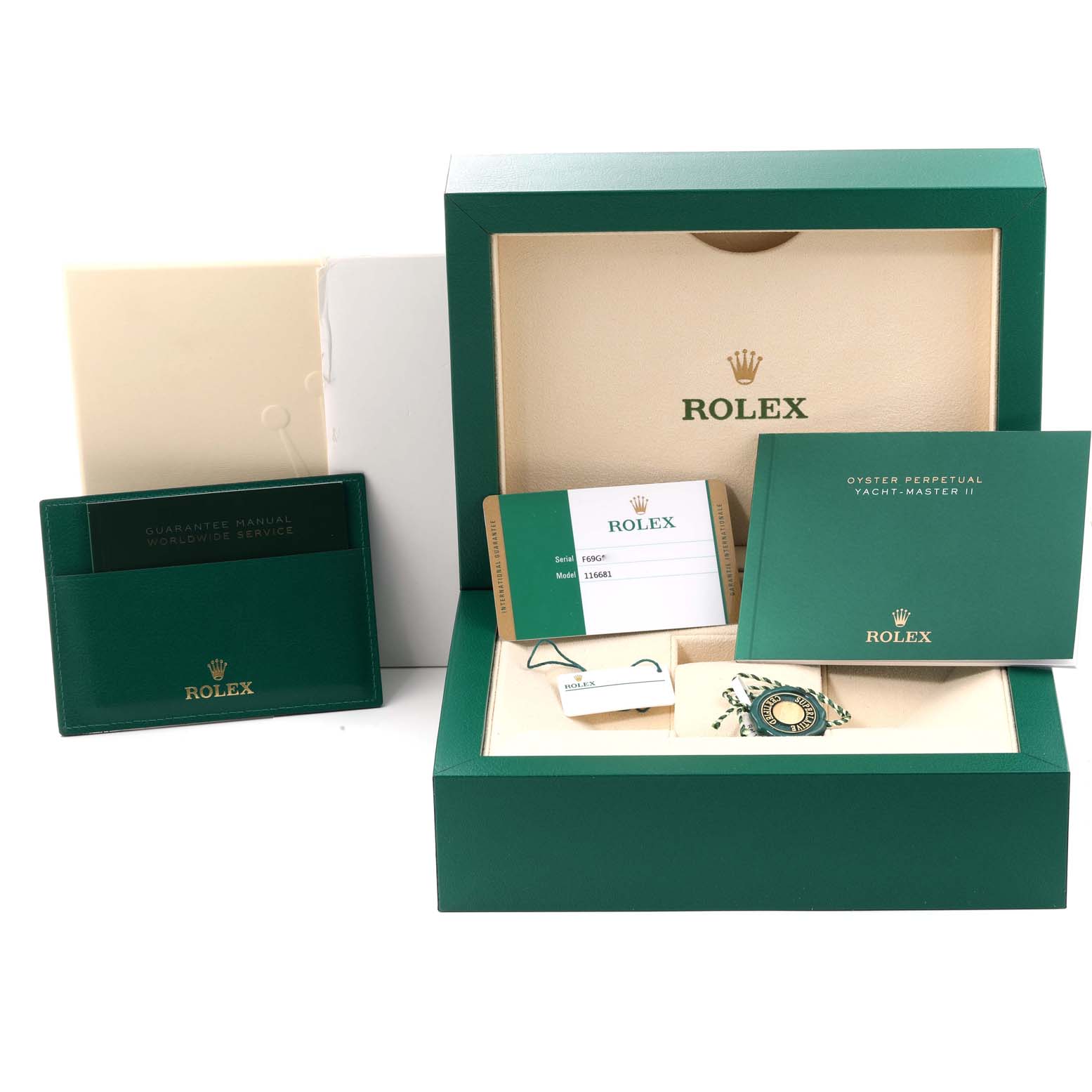 The image shows a Rolex Yacht-Master 116681 Men's Steel and Gold (two tone) White Dial 116681 Men's Steel and Gold (two tone) White Dial watch box and accessories, including a guarantee manual, warranty card, and hang tags, viewed from the front.