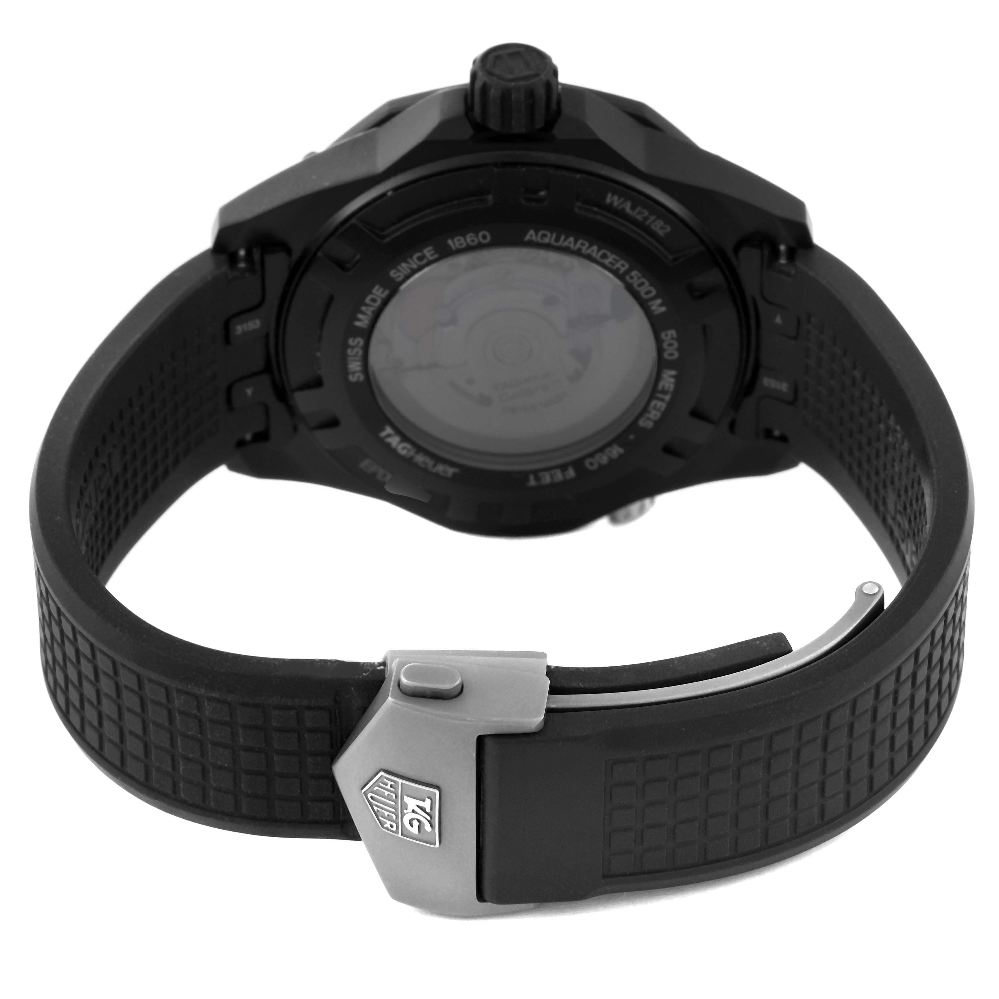The image shows the back view of a Tag Heuer Aquaracer WAJ2182 Men's Titanium Black Dial WAJ2182 Men's Titanium Black Dial watch, highlighting its case back and rubber strap with clasp.