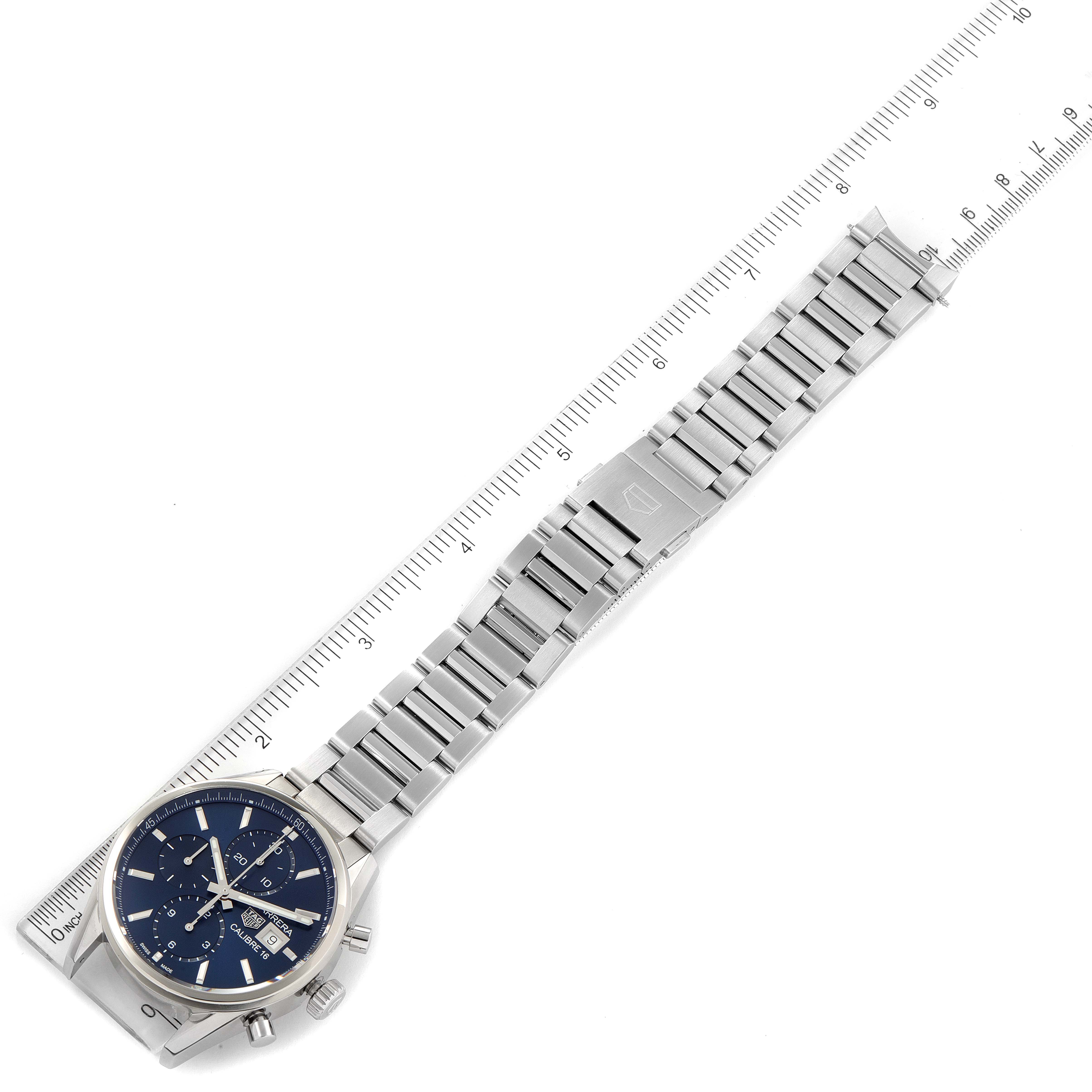 The image shows a Tag Heuer Carrera CBK2112.BA0715 Men
s Stainless Steel Blue Dial CBK2112.BA0715 Men
s Stainless Steel Blue Dial watch with a stainless steel bracelet, laid out flat with a ruler for scale.