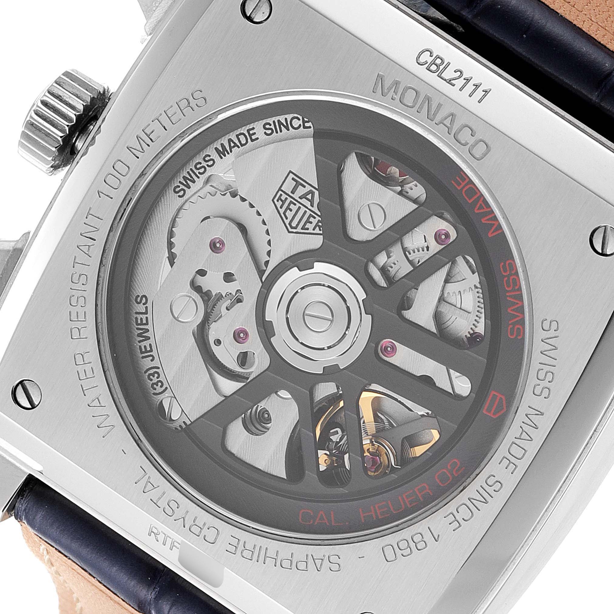 The image shows the back view of a Tag Heuer Monaco CBL2111.FC6453 Men's Stainless Steel Blue Dial CBL2111.FC6453 Men's Stainless Steel Blue Dial model, highlighting its inner mechanisms and automatic movement.