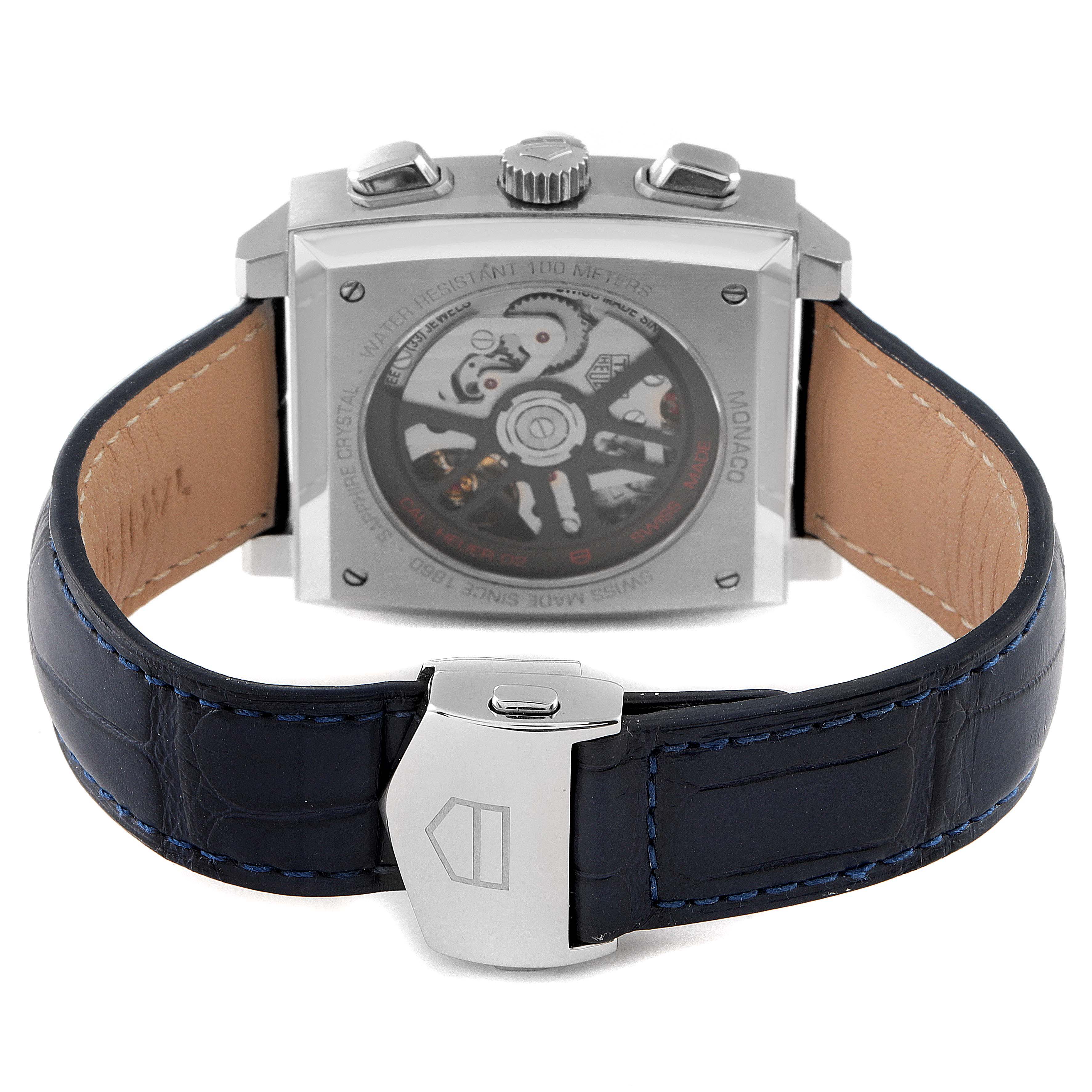This image shows the back view of the Tag Heuer Monaco CBL2111.FC6453 Men's Stainless Steel Blue Dial CBL2111.FC6453 Men's Stainless Steel Blue Dial watch, displaying its movement through a transparent case back and claps.