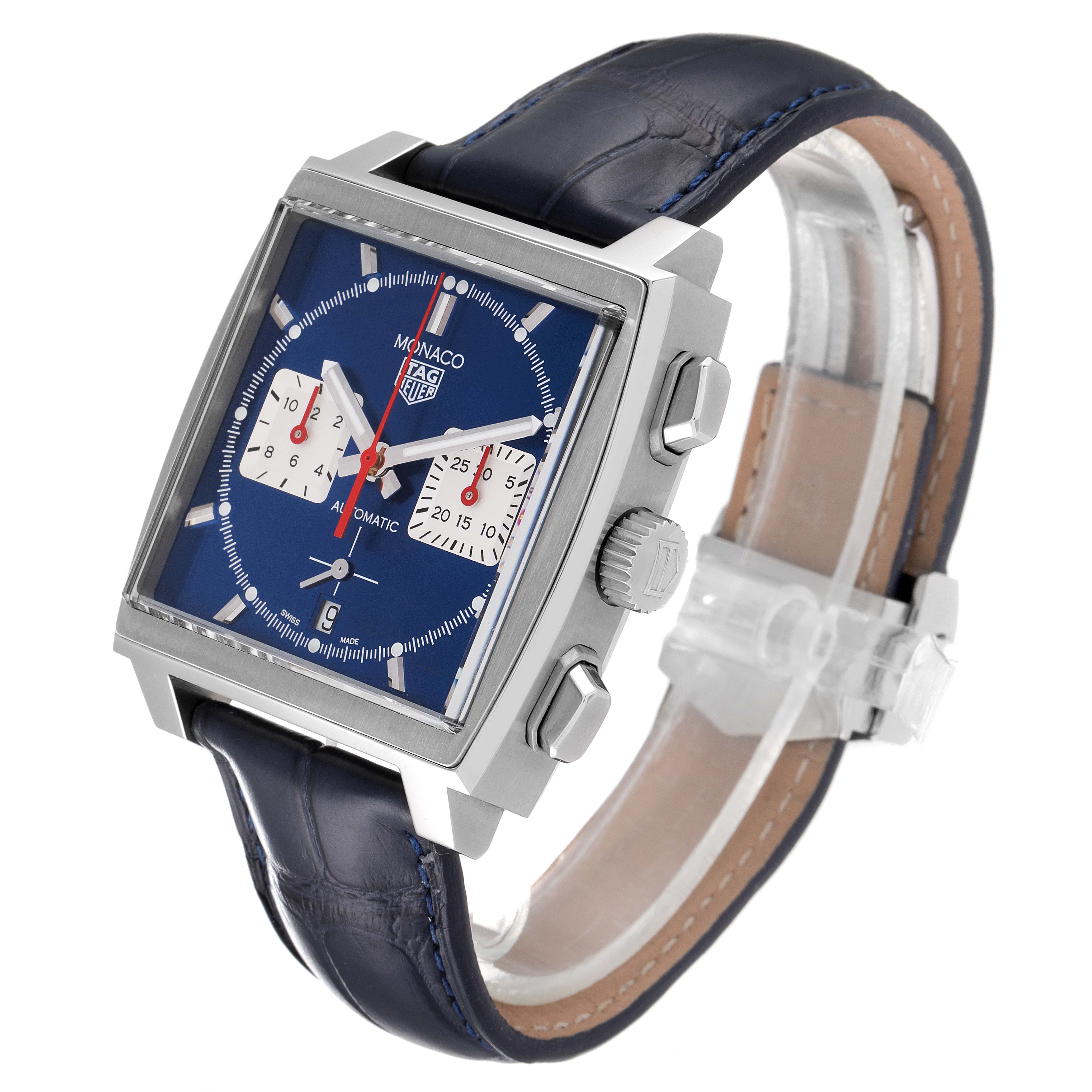 The Tag Heuer Monaco CBL2111.FC6453 Men's Stainless Steel Blue Dial CBL2111.FC6453 Men's Stainless Steel Blue Dial watch is shown at an angled side view, highlighting its blue face, dual white subdials, and leather strap.