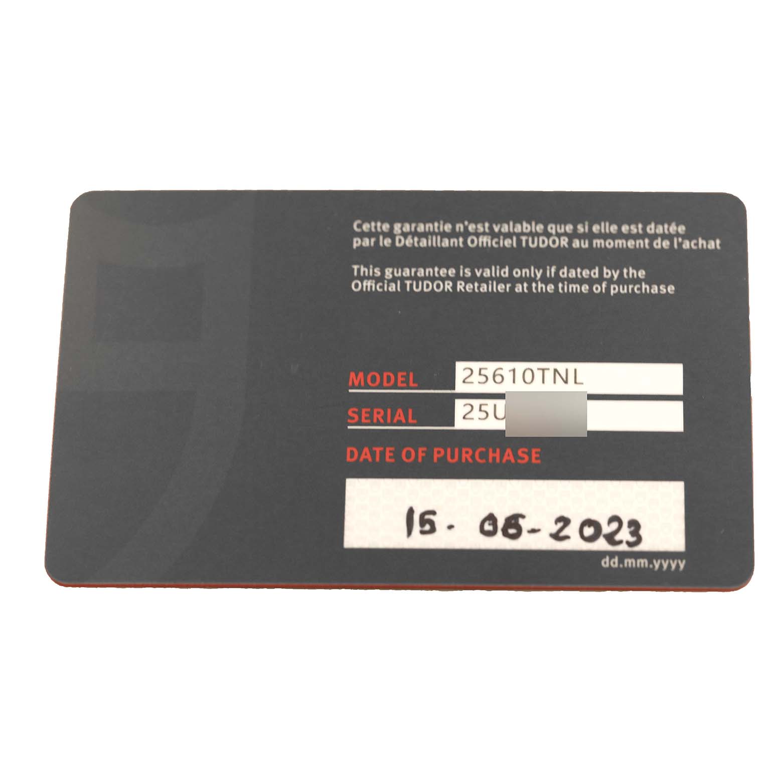 The image shows the warranty card for a Tudor Pelagos 25610TNL Men
s Titanium Black Dial 25610TNL Men
s Titanium Black Dial model watch with model number 25610TNL.