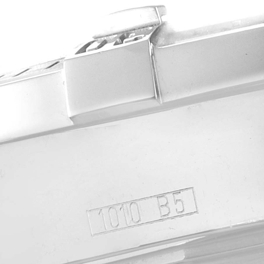 The image shows a close-up side view of a Breitling Colt A17380 Men
s Stainless Steel Black Dial A17380 Men
s Stainless Steel Black Dial watch
s case with an engraved serial number.