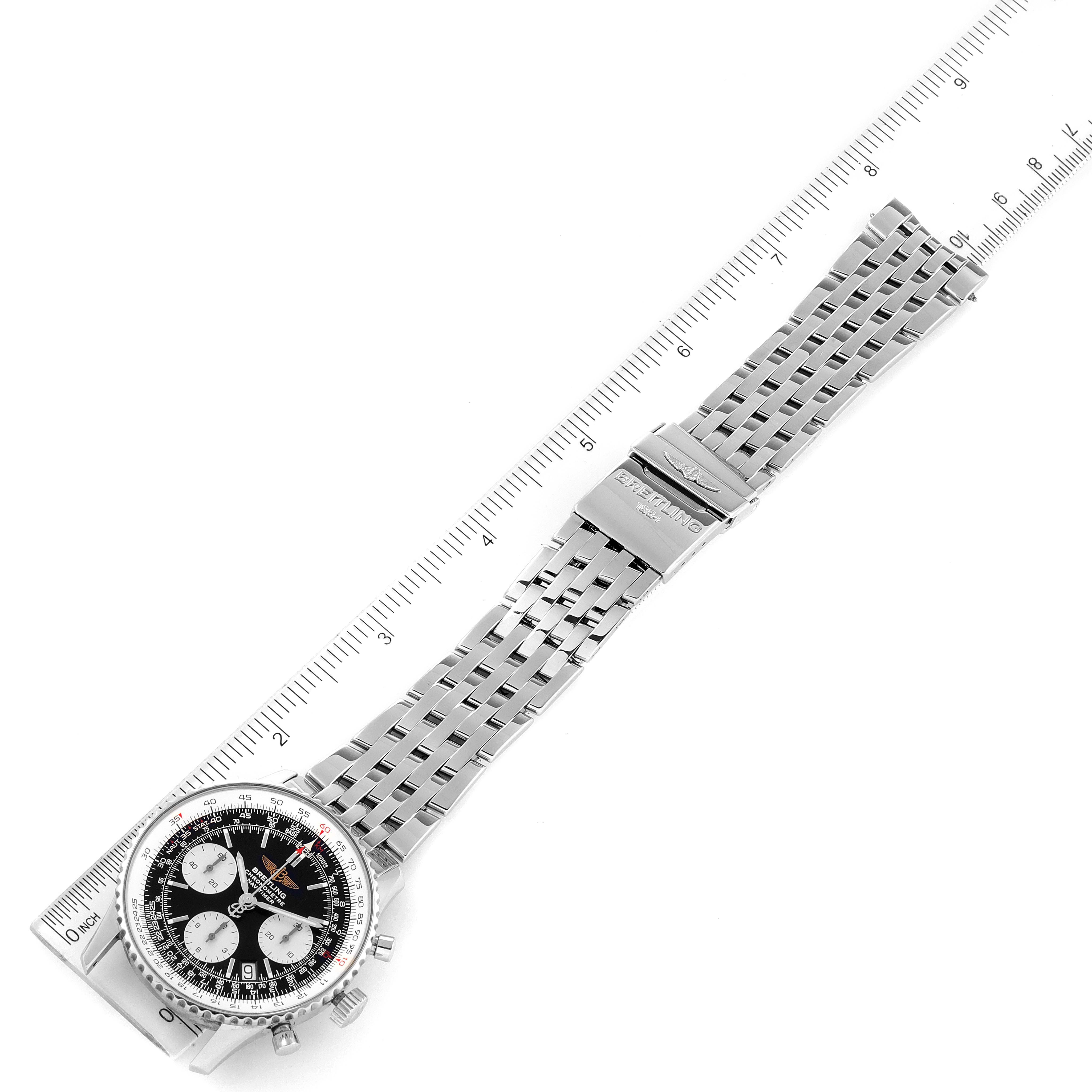 The image shows the Breitling Navitimer A23322 Men's Stainless Steel Black Dial A23322 Men's Stainless Steel Black Dial watch at an overhead angle, highlighting the dial, bracelet, and clasp, with a ruler for scale.