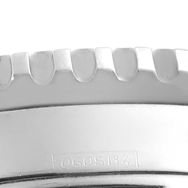 The image shows a close-up of the stainless steel bezel of a Breitling Navitimer A23322 Men's Stainless Steel Black Dial A23322 Men's Stainless Steel Black Dial watch model.