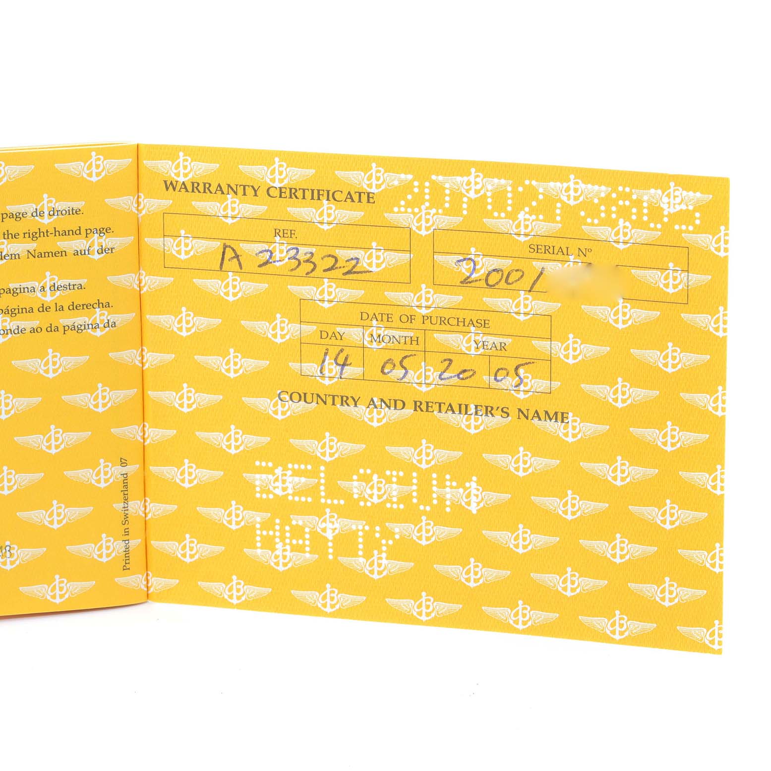 The image shows an open warranty certificate booklet for the Breitling Navitimer A23322 Men's Stainless Steel Black Dial A23322 Men's Stainless Steel Black Dial watch model.