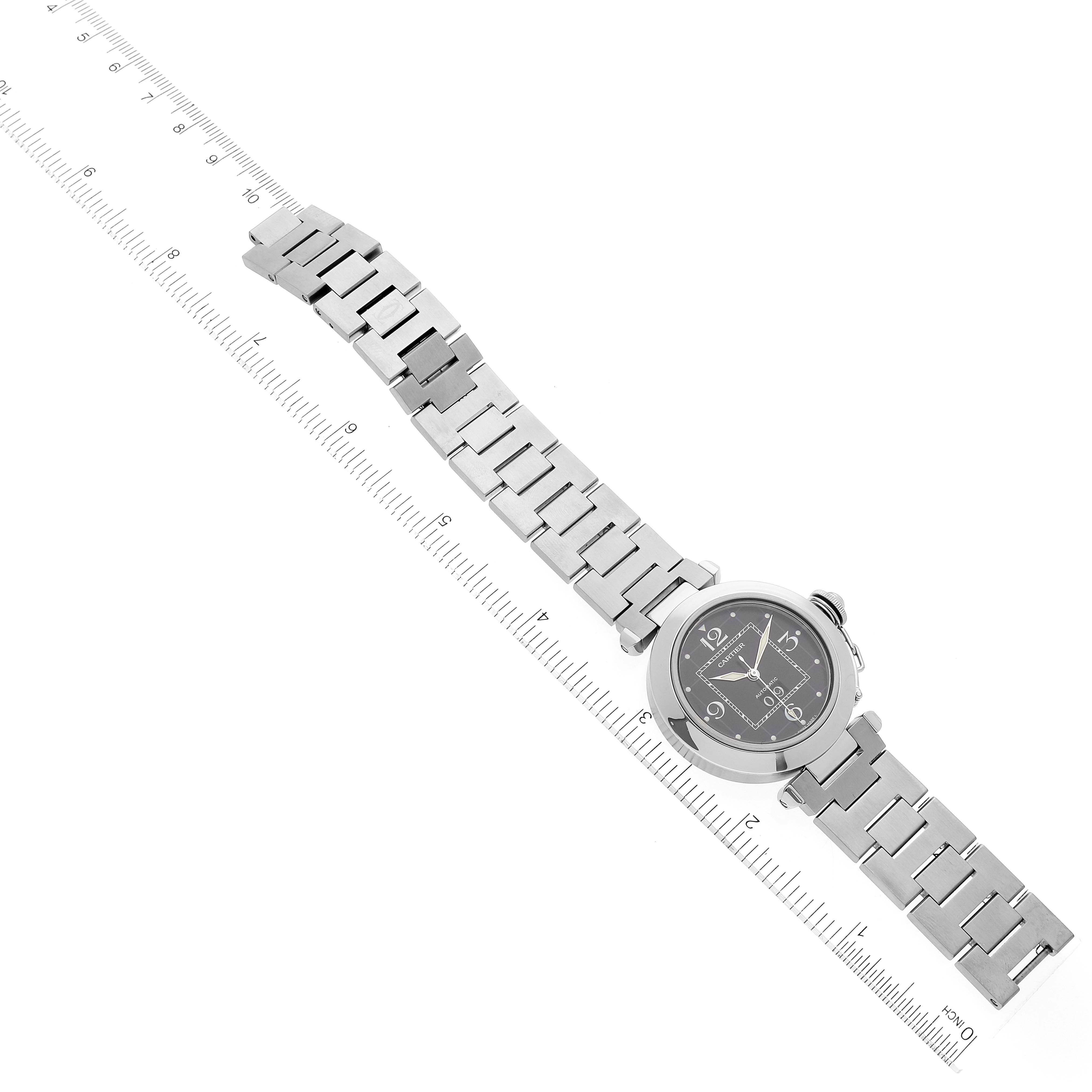 The image shows a Cartier Pasha W31053M7 Women's Stainless Steel Black Dial W31053M7 Women's Stainless Steel Black Dial model watch, viewed from a top-down angle, displaying the full length of the band and the watch face.