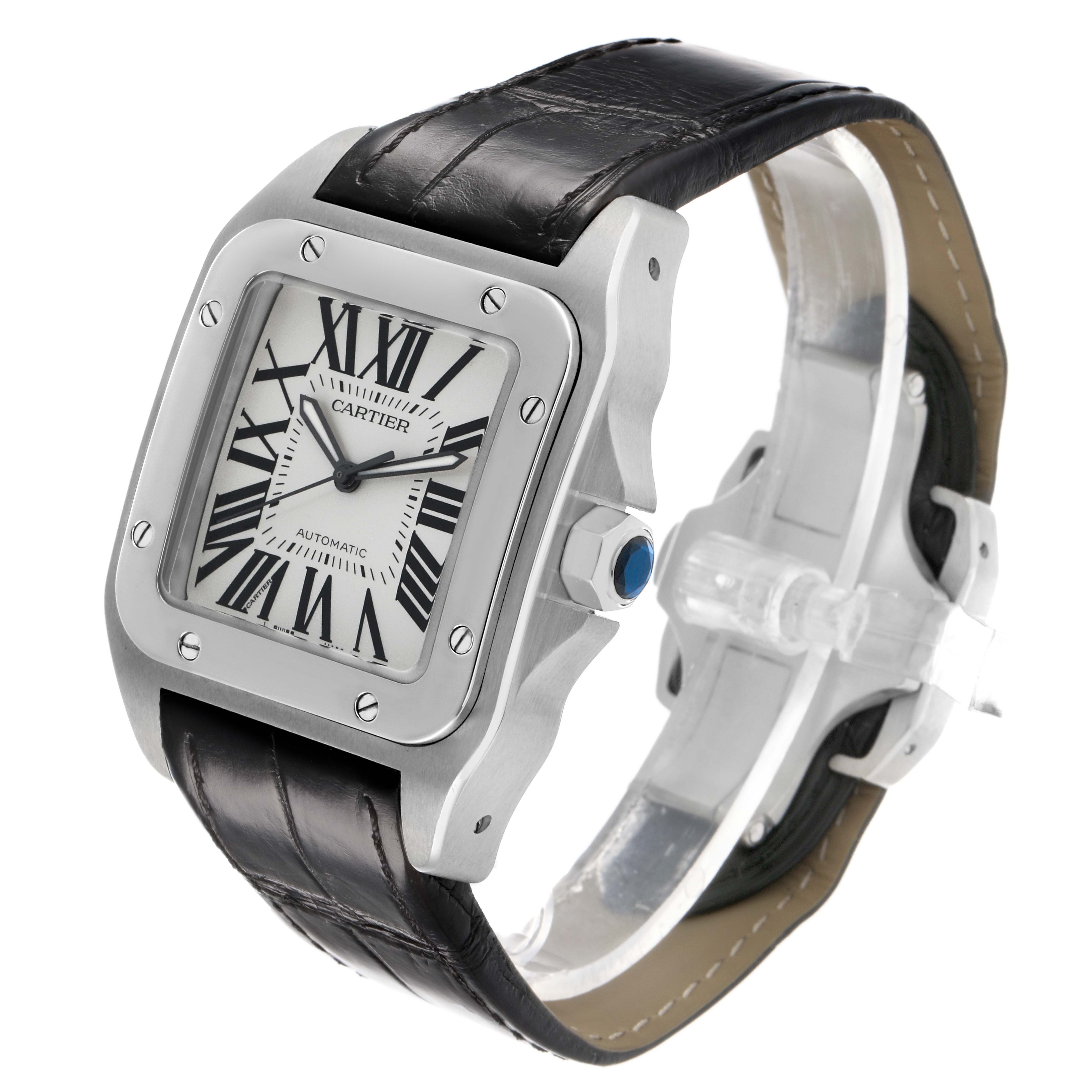 The Cartier Santos W20073X8 Men's Stainless Steel Silver Dial watch is shown at a three-quarter angle, highlighting the face, bezel, strap, and crown with its blue cabochon.