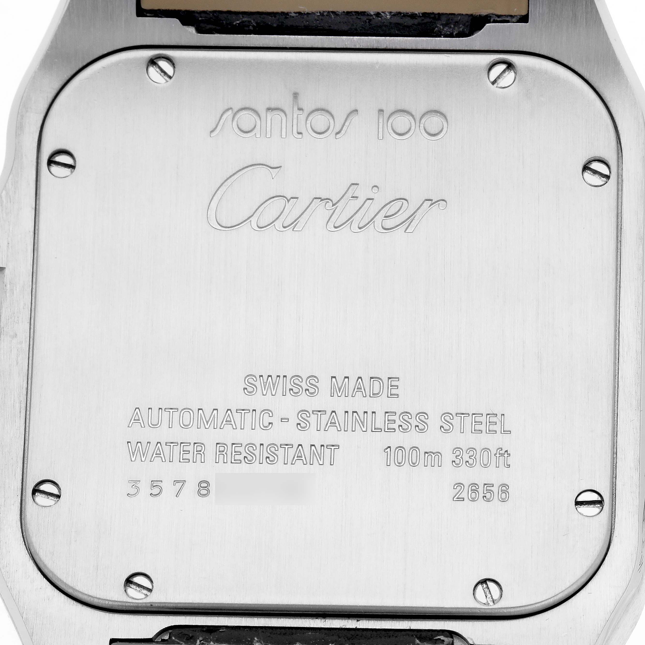 The image shows the case back of a Cartier Santos W20073X8 Men's Stainless Steel Silver Dial 100, displaying branding, model details, and water resistance information.