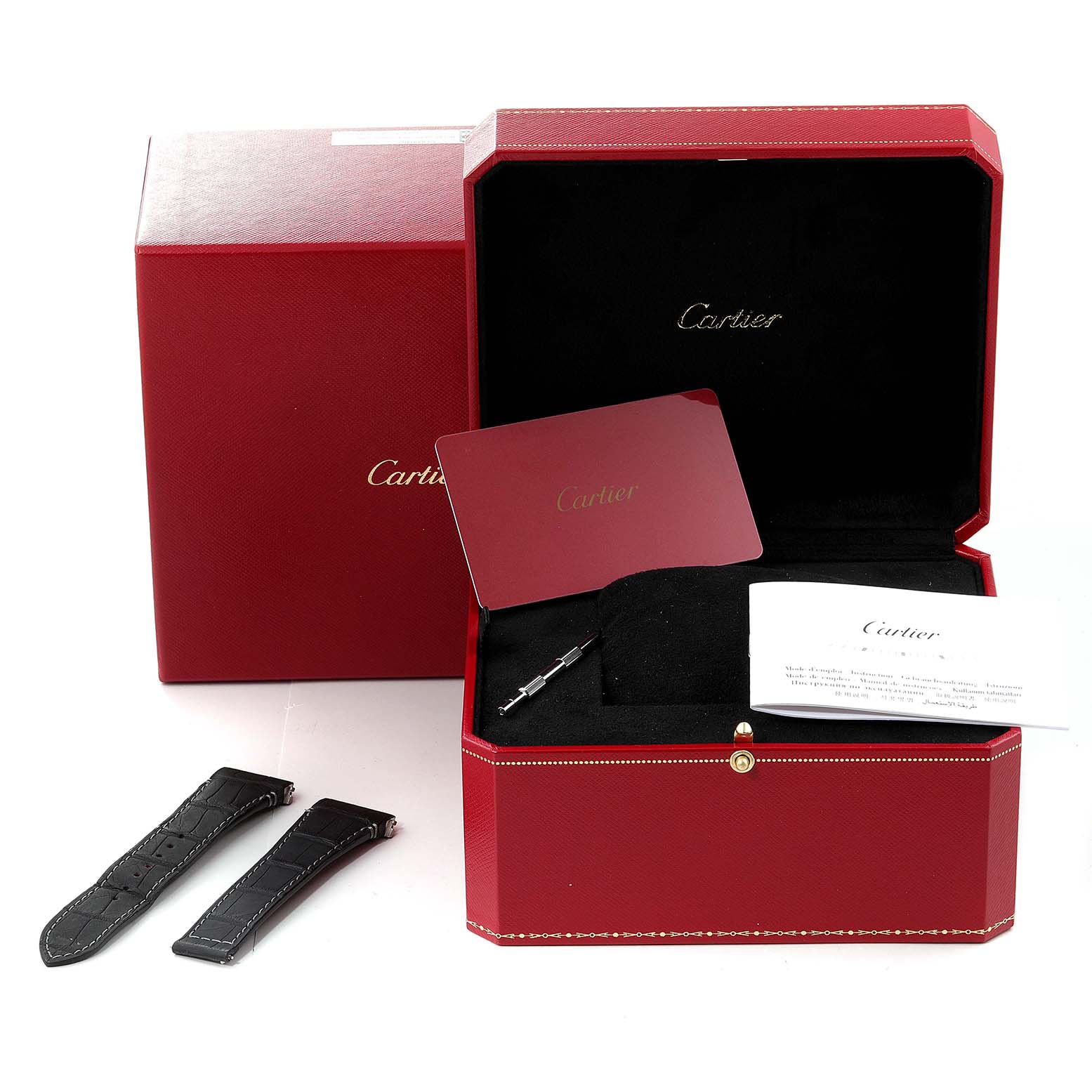 The image shows the packaging for a Cartier Santos WSSA0017 Men's Stainless Steel Silver Dial WSSA0017 Men's Stainless Steel Silver Dial watch, including the box, extra straps, and accompanying paperwork.