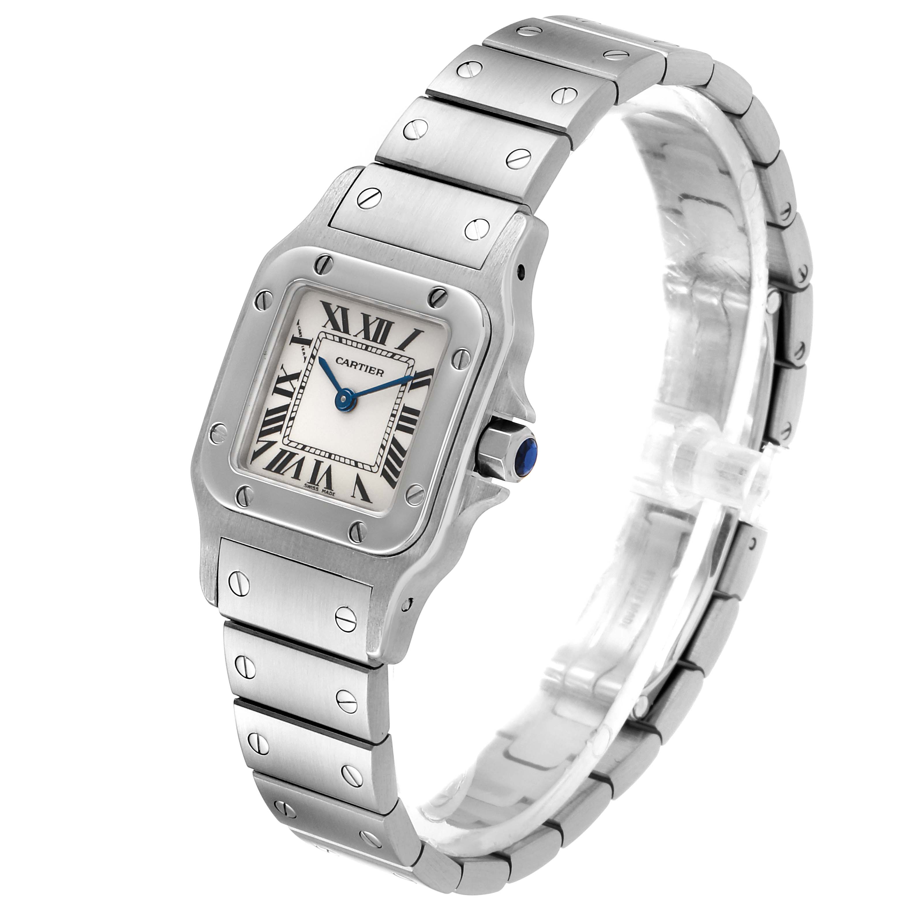 The image shows a Santos model watch by Cartier from a three-quarter angle, highlighting the watch face and stainless steel bracelet.