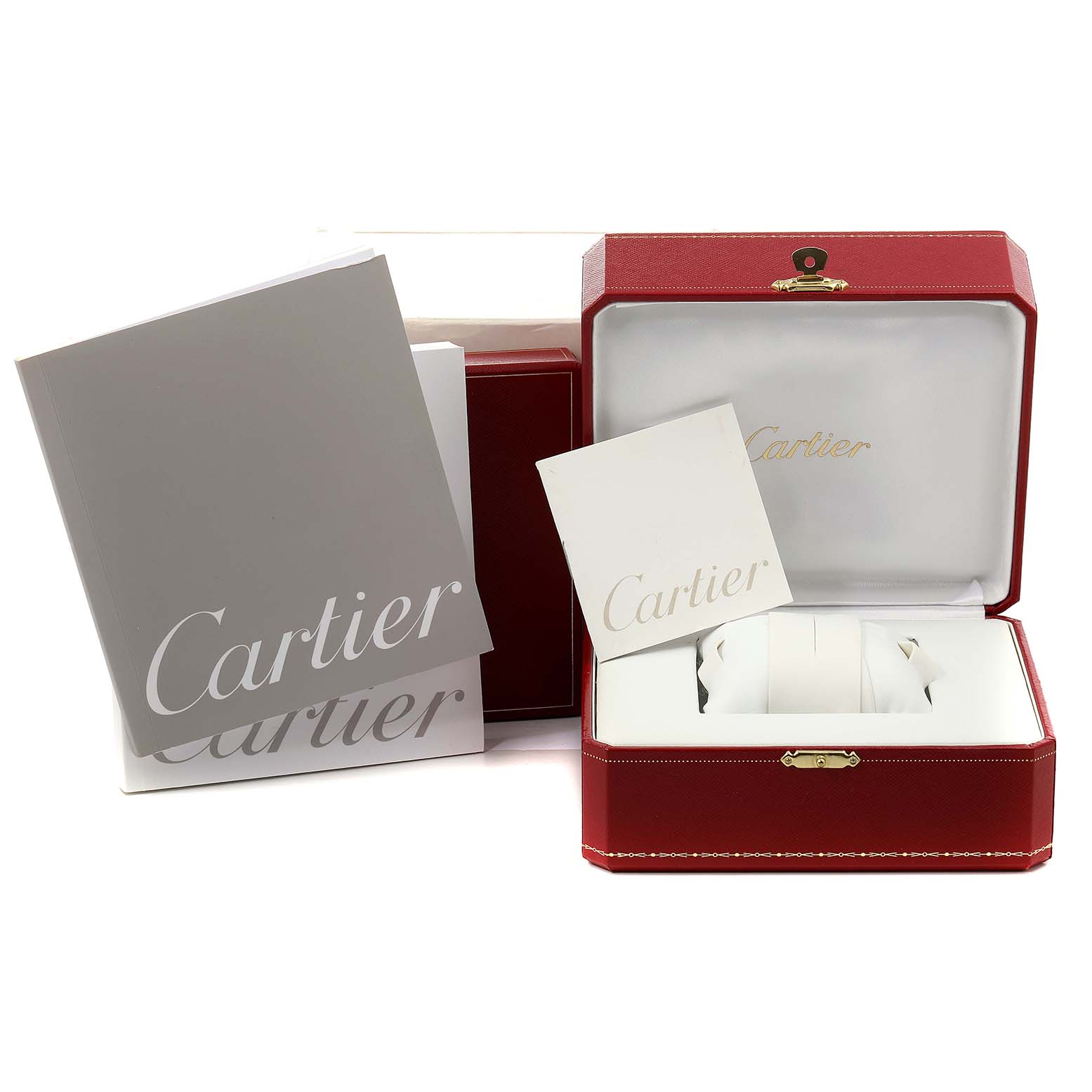 The image shows a Santos model Cartier watch box with accompanying manuals and warranty cards.
