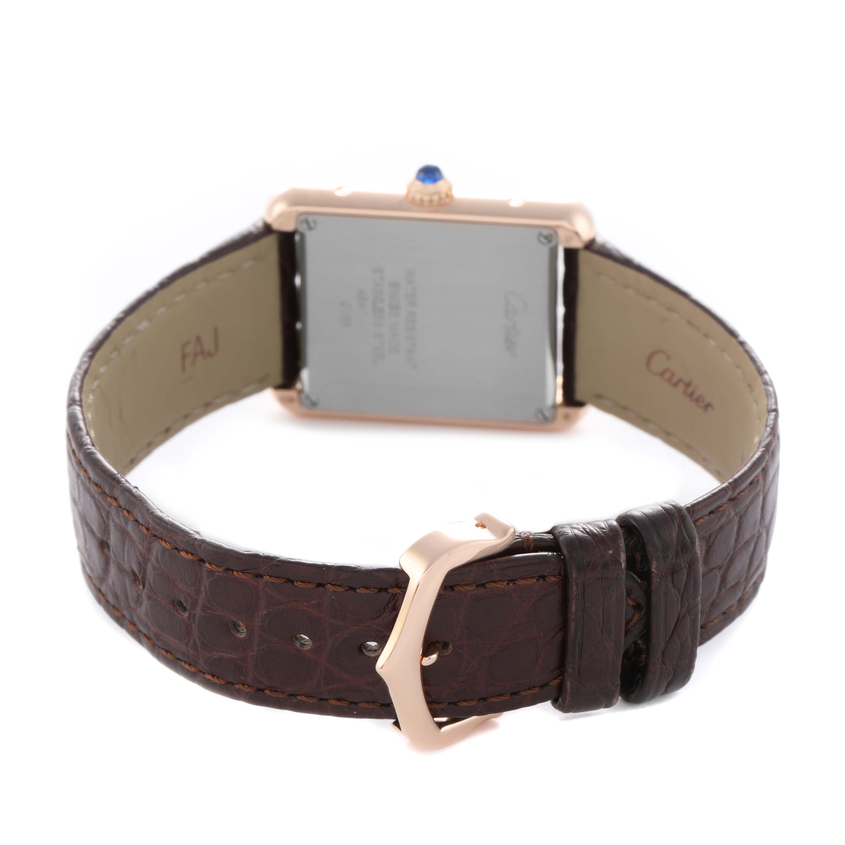 The Cartier Tank Solo W5200024 Women's Rose Gold Silver Dial watch is shown from the back, highlighting the case back, crown, and leather strap with buckle.