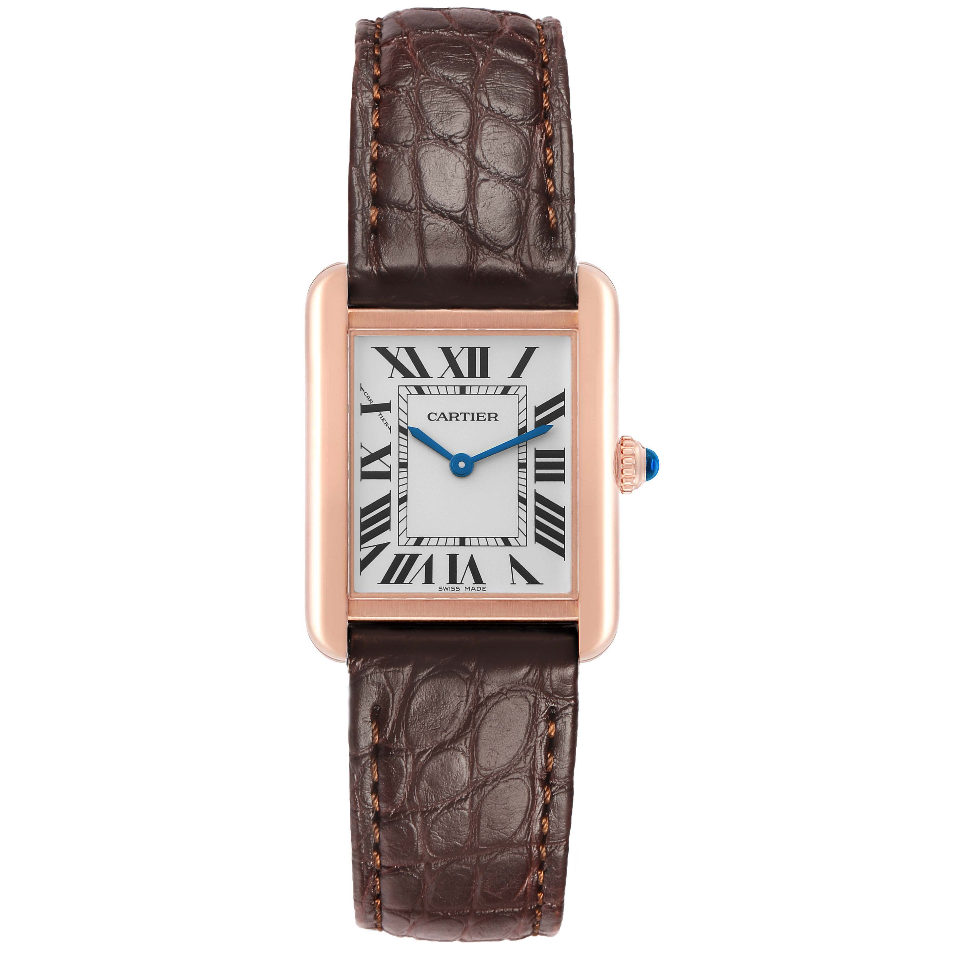 The Cartier Tank Solo W5200024 Women's Rose Gold Silver Dial watch is shown from a top-down angle, displaying its rectangular face, roman numerals, and leather strap.