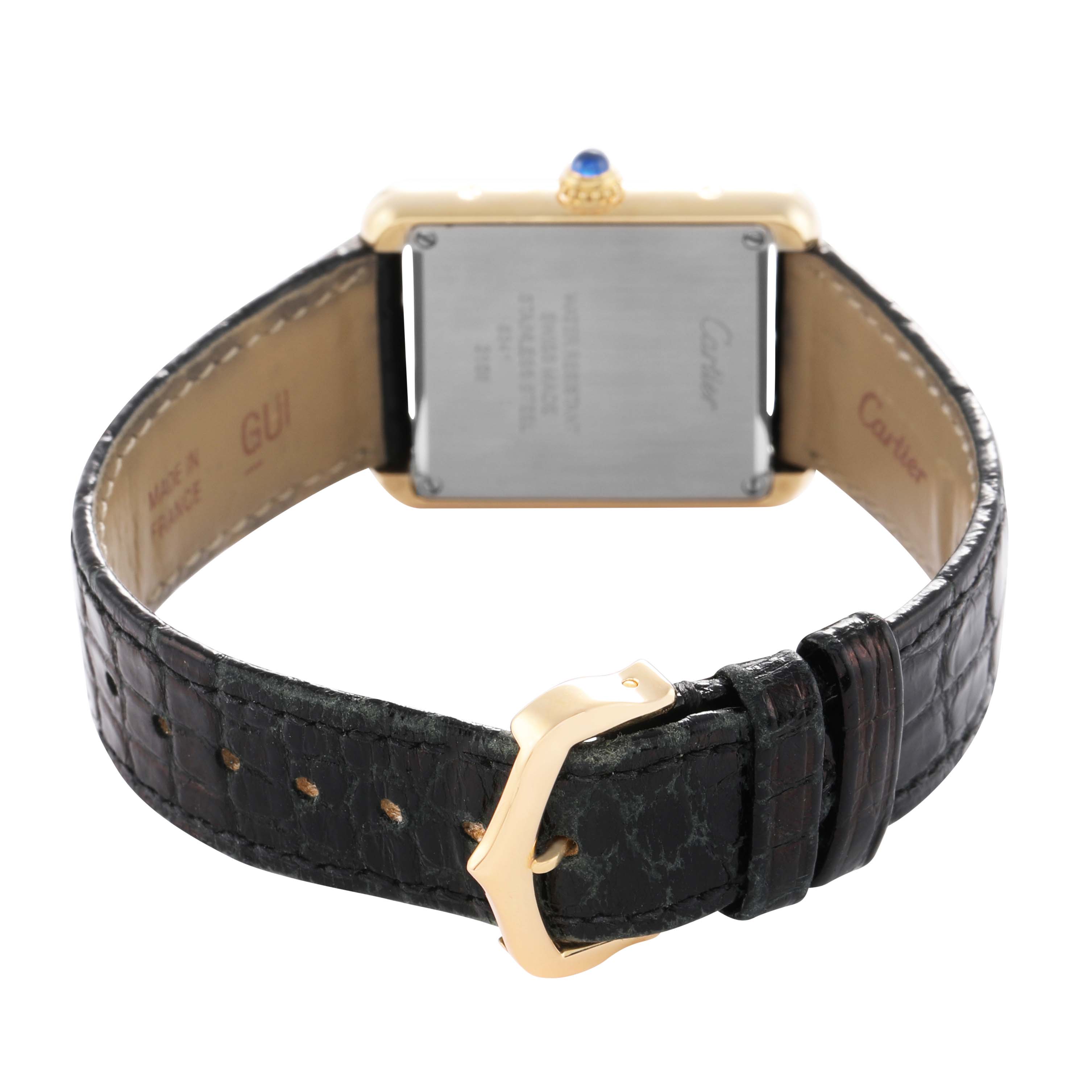 The image shows the back of a Cartier Tank Solo W5200002 Women's Yellow Gold Silver Dial watch with the strap and buckle visible.