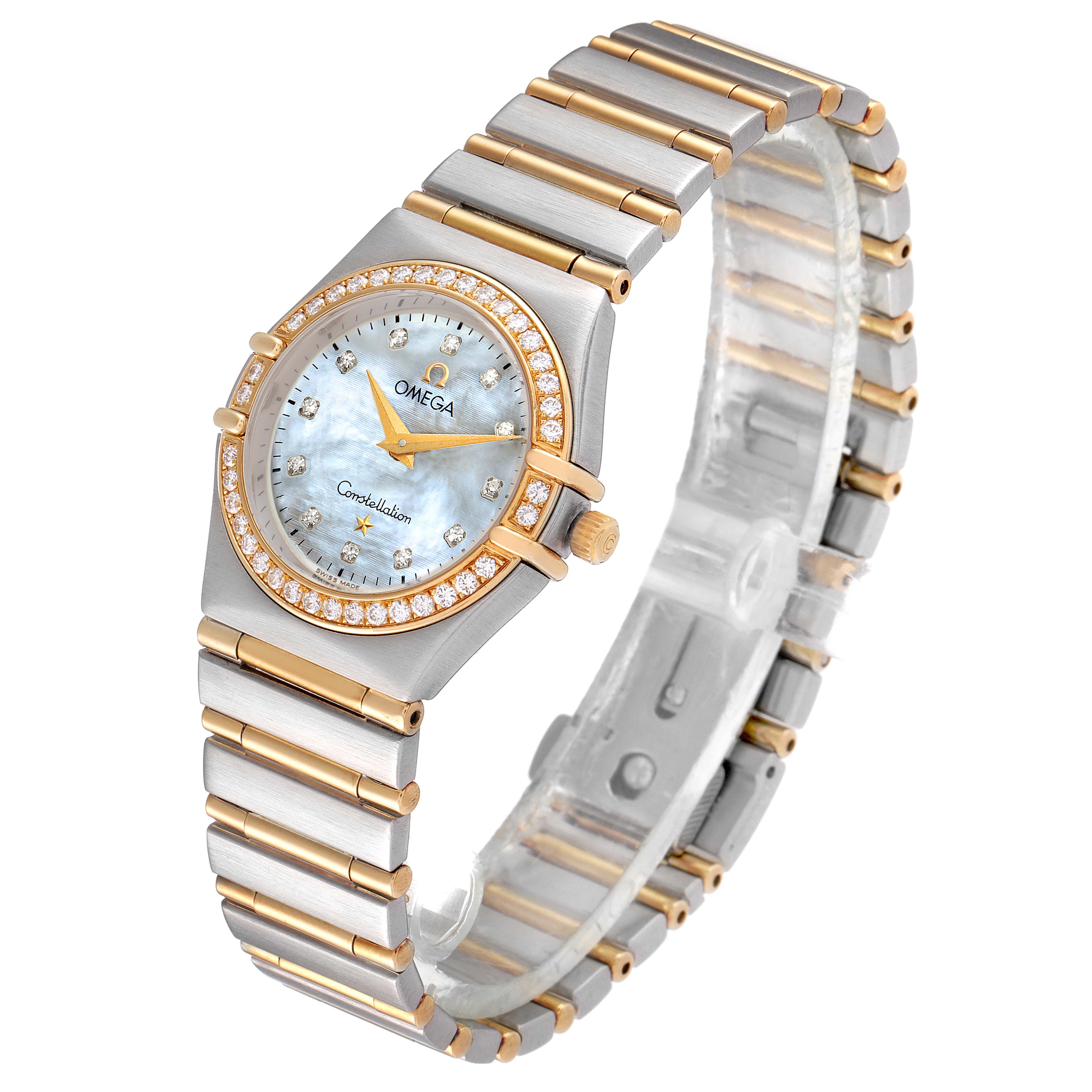The image shows an angled view of the Omega 1277.75.00 Women
s Steel and Gold (two tone) Mother of Pearl Dial 1277.75.00 Women
s Steel and Gold (two tone) Mother of Pearl Dial Constellation 95 Steel Yellow Gold MOP Diamond Ladies Watch 1277.75.00, displaying its face and bracelet.