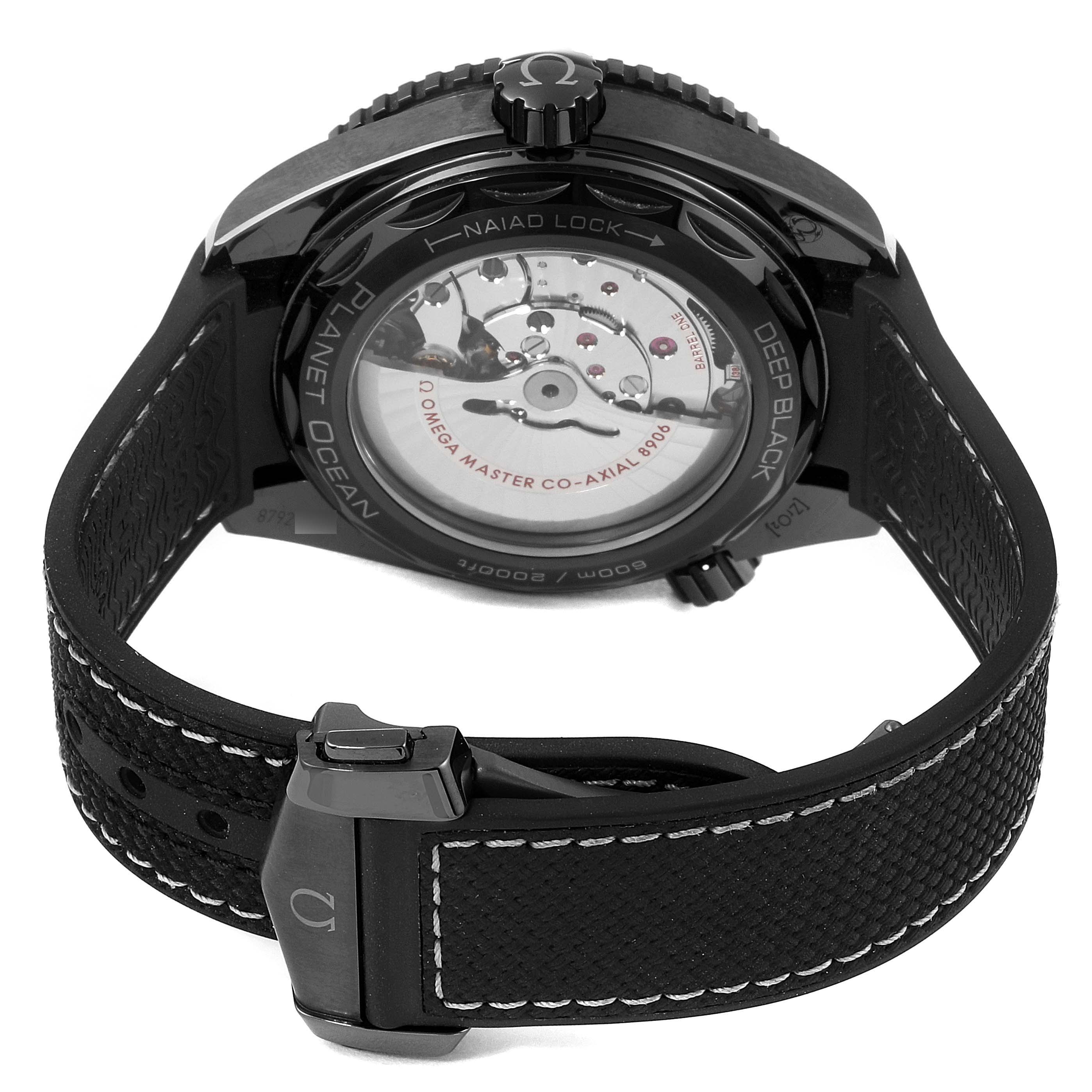 The image shows the back of the Omega Planet Ocean 215.92.46.22.01.001 Men's Stainless Steel Black Dial 215.92.46.22.01.001 Men's Stainless Steel Black Dial watch revealing the movement and a portion of the strap.
