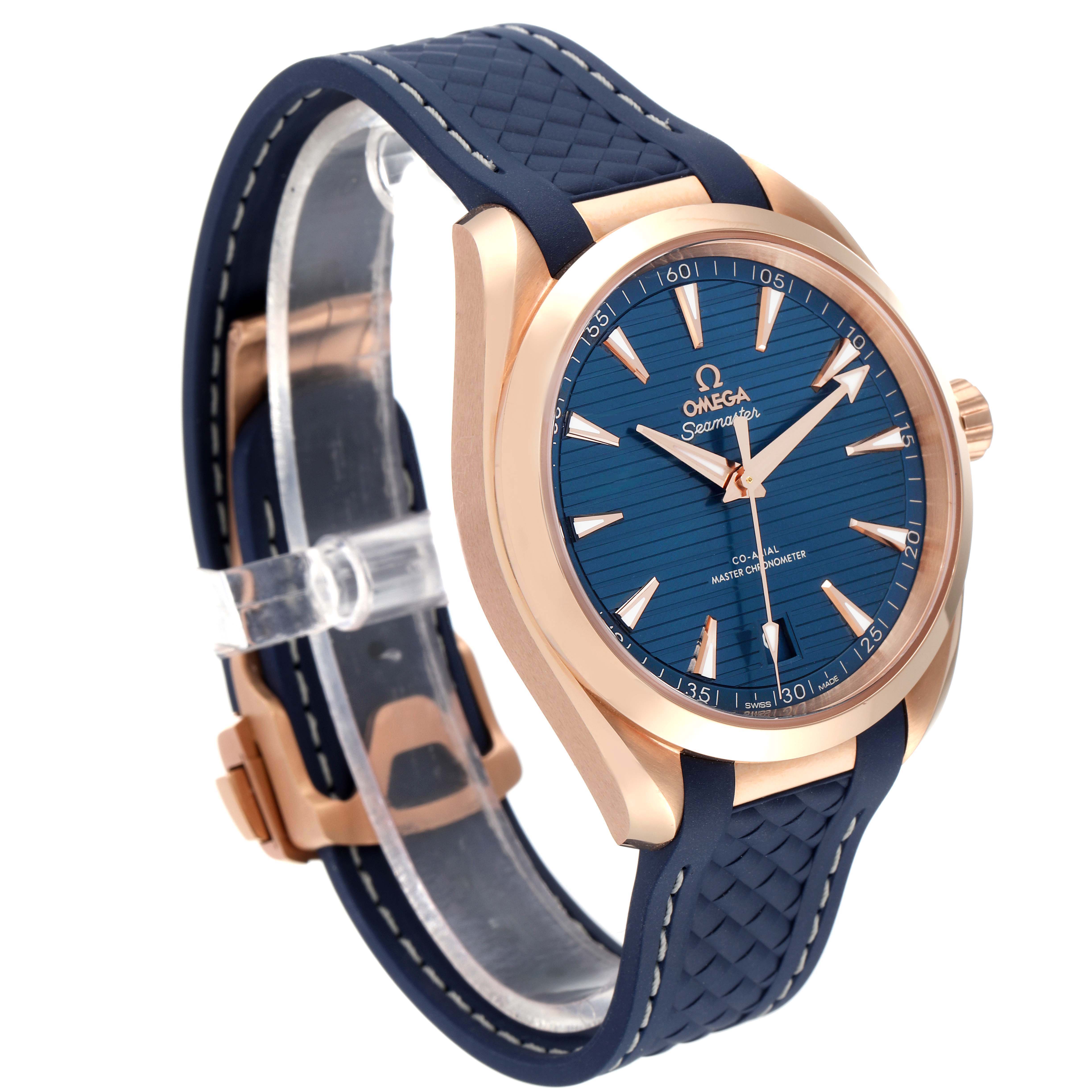 The Omega Aqua Terra 220.52.41.21.03.001 Men's Rose Gold Blue Dial watch is shown at a three-quarter angle, highlighting the blue dial, rose gold case, and blue strap.
