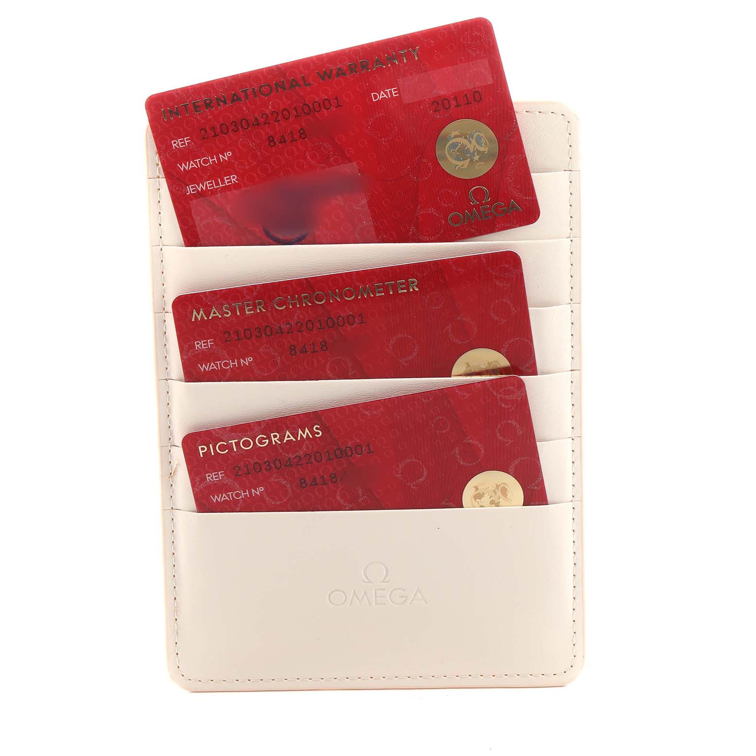 The image shows warranty cards and documents for an Omega Seamaster 210.30.42.20.10.001 Men's Stainless Steel Green Dial watch arranged in a cream-colored card holder.