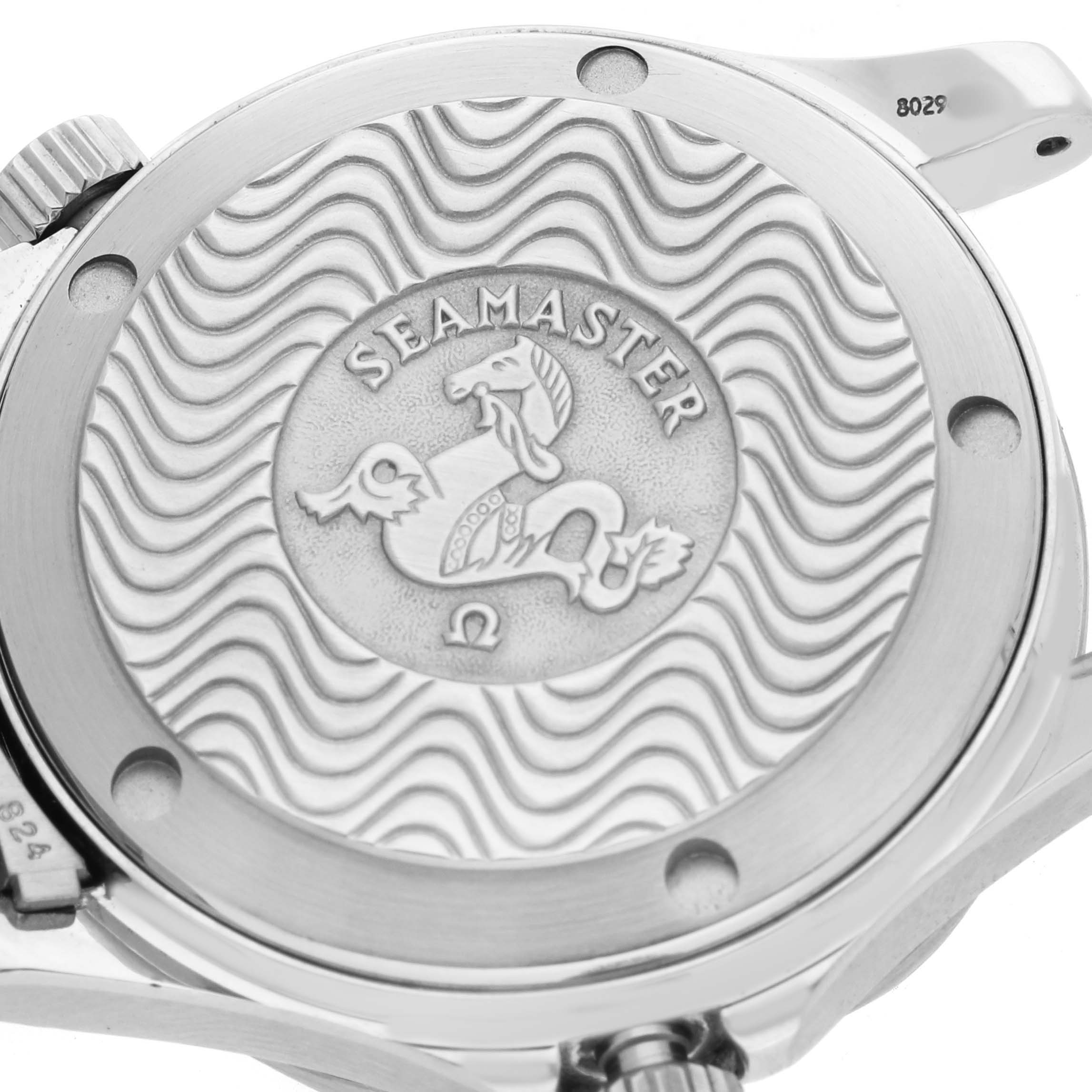 The image shows the case back of the Omega Seamaster 2551.80.00 Men's Stainless Steel Blue Dial watch, featuring a wave pattern and emblem.