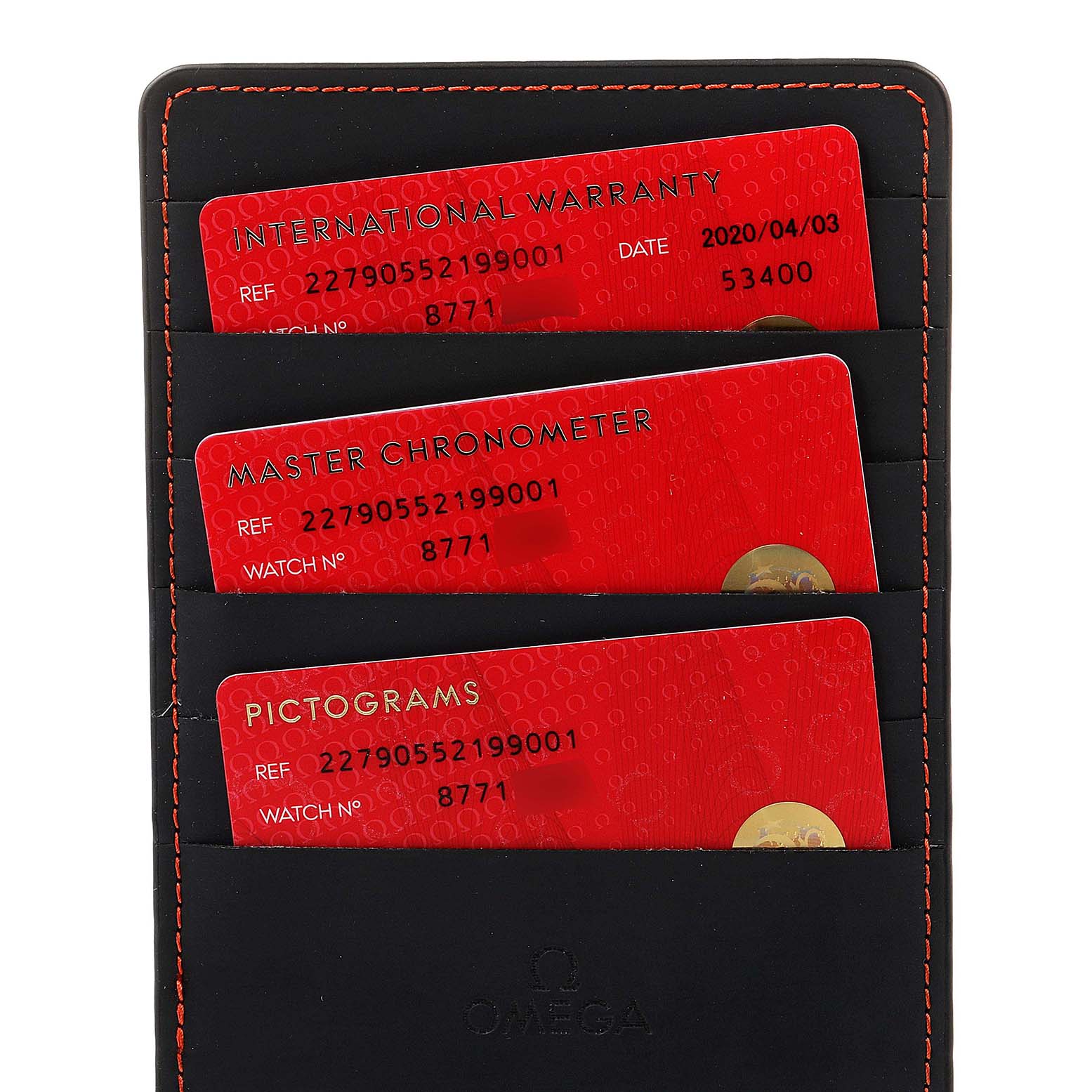 This image shows three red Omega cards—International Warranty, Master Chronometer, and Pictograms—in a black holder.