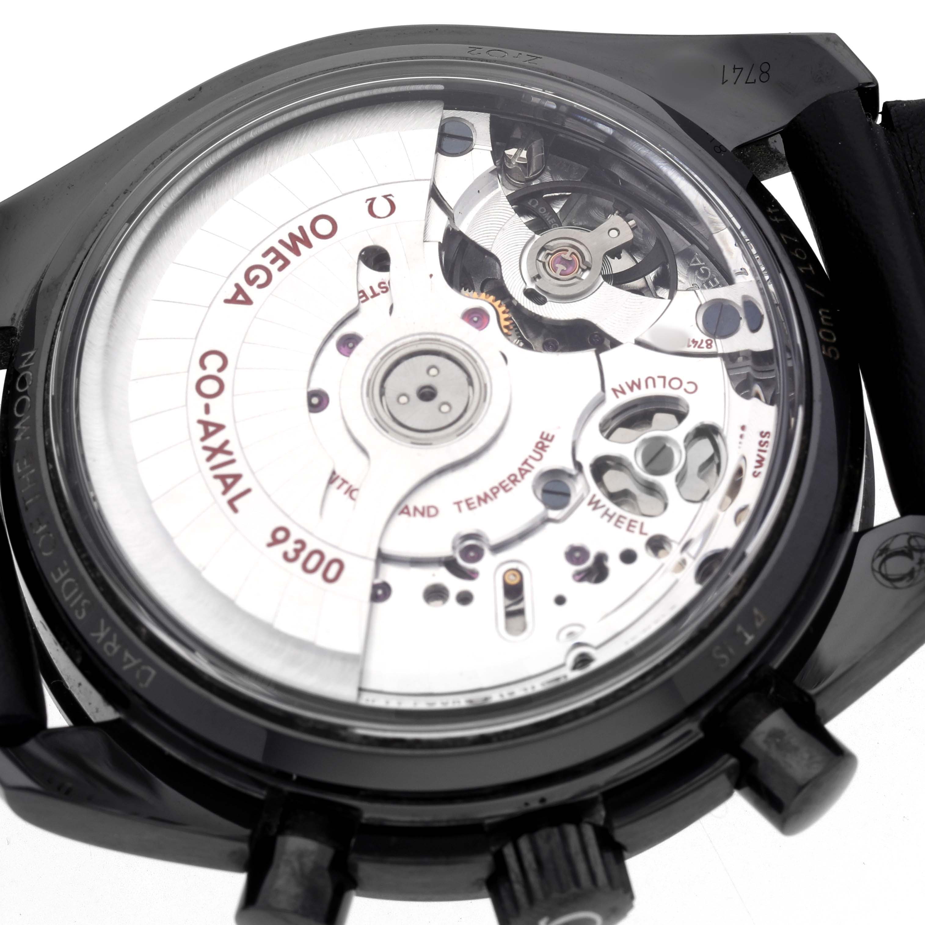 The image shows the back of an Omega Speedmaster O311.92.44.51.01.003 Men's Ceramic Black Dial, displaying the Co-Axial 9300 movement mechanism.
