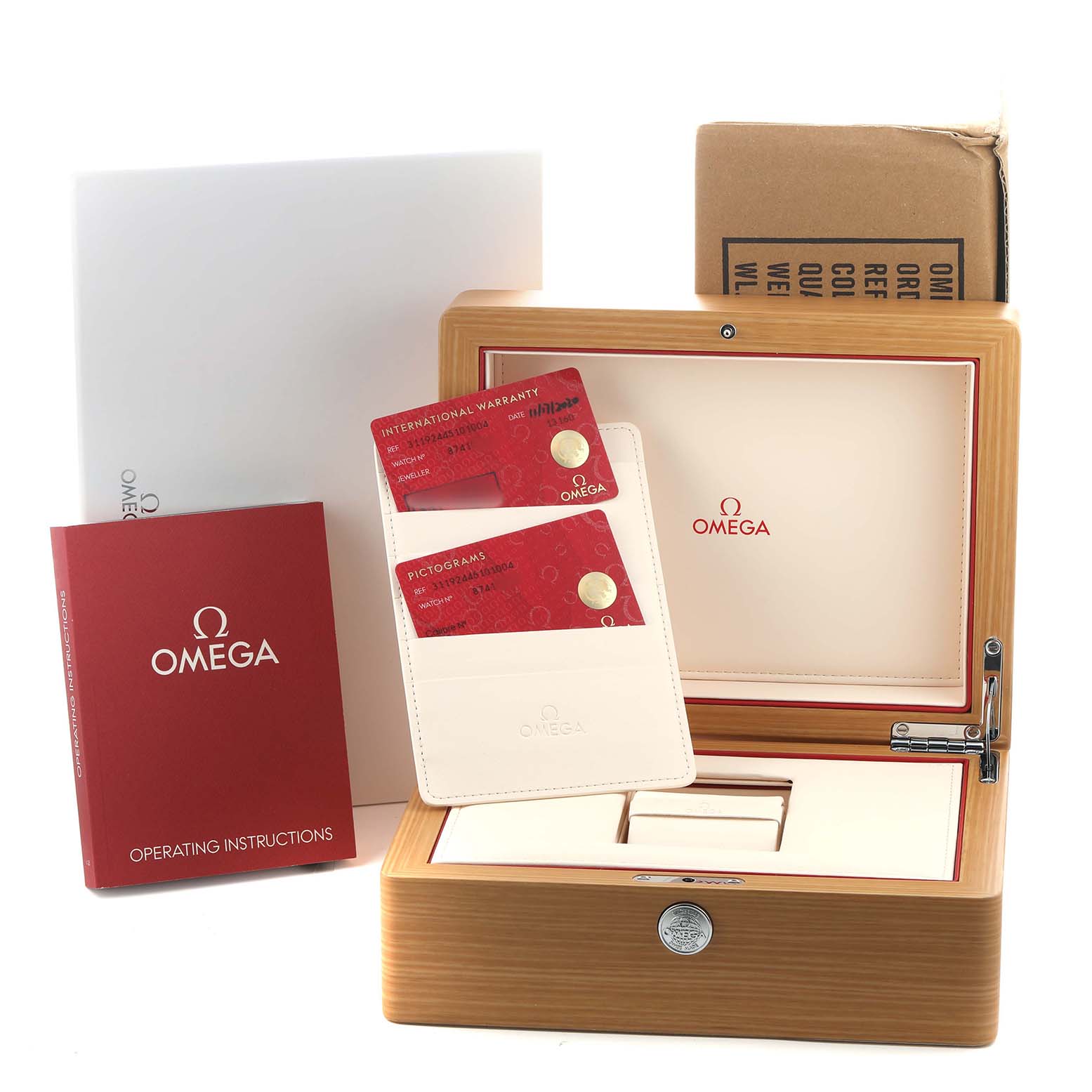 The image shows the box and accessories for an Omega Speedmaster O311.92.44.51.01.003 Men's Ceramic Black Dial, including warranty cards, a manual, and the presentation box.