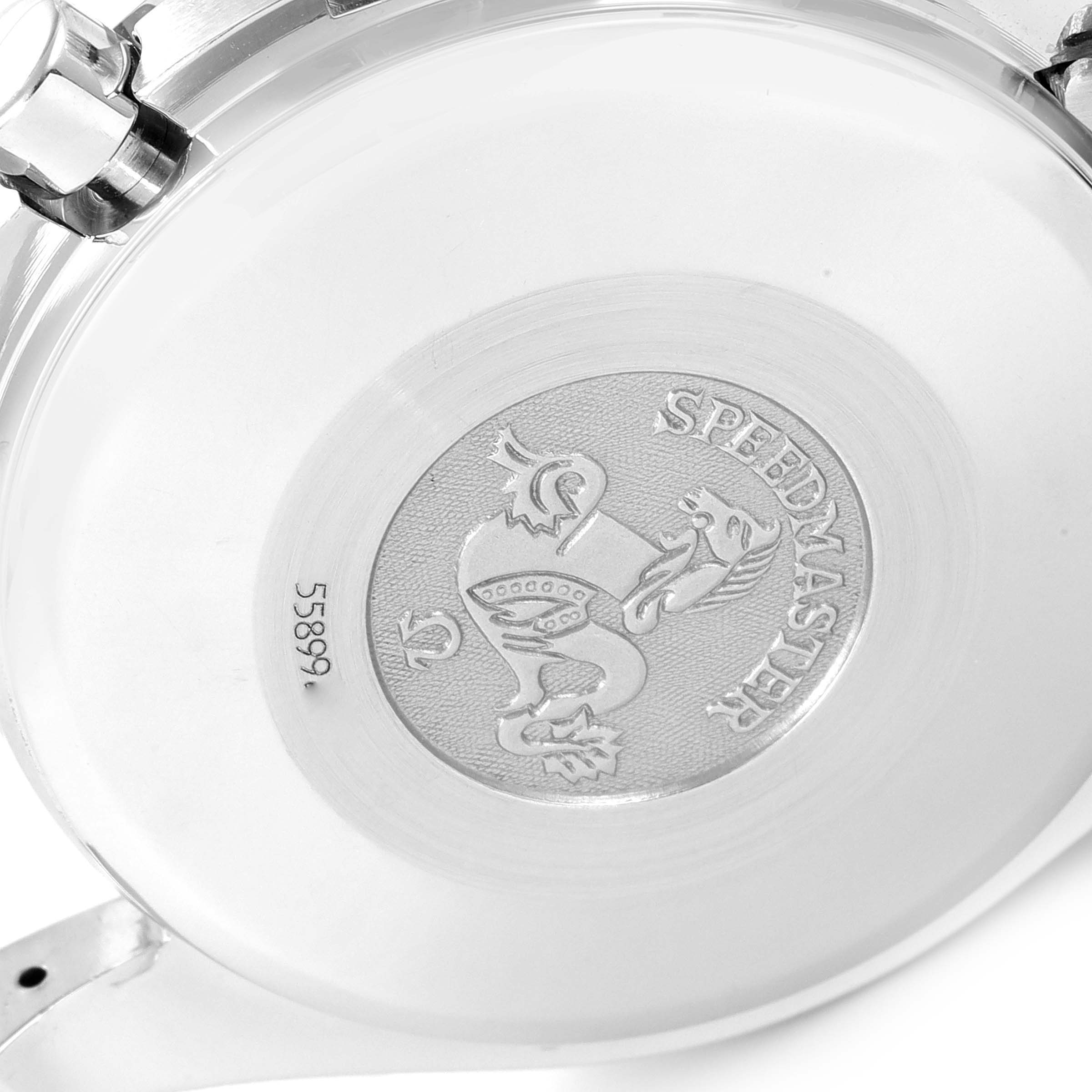 The image shows the back case of an Omega Speedmaster 3520.50.00 Men
s Stainless Steel Black Dial 3520.50.00 Men
s Stainless Steel Black Dial watch with an engraving and part of the bracelet.