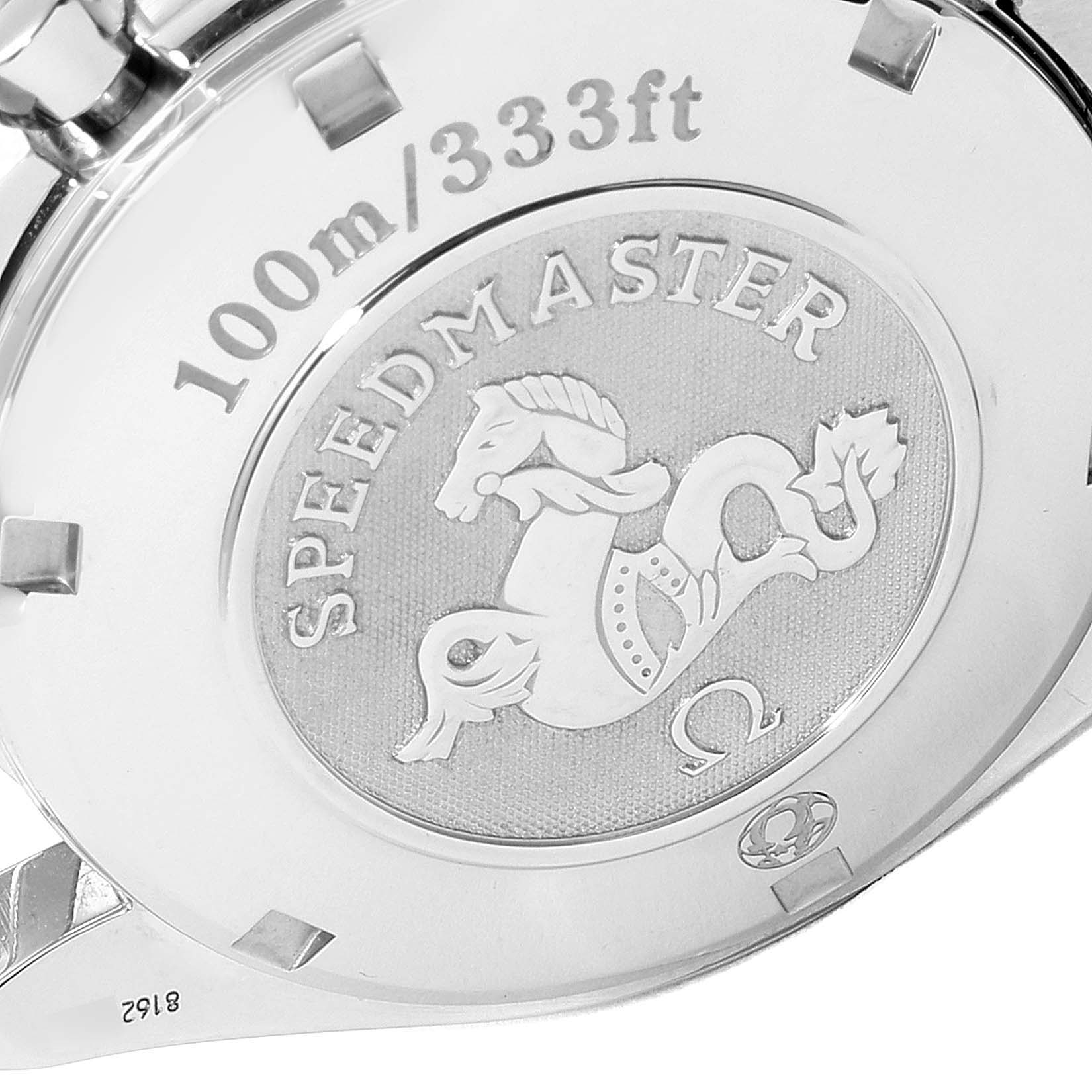 The image shows the case back of an Omega Speedmaster 3222.80.00 Men
s Stainless Steel Blue Dial 3222.80.00 Men
s Stainless Steel Blue Dial watch, featuring its emblem and water resistance details.