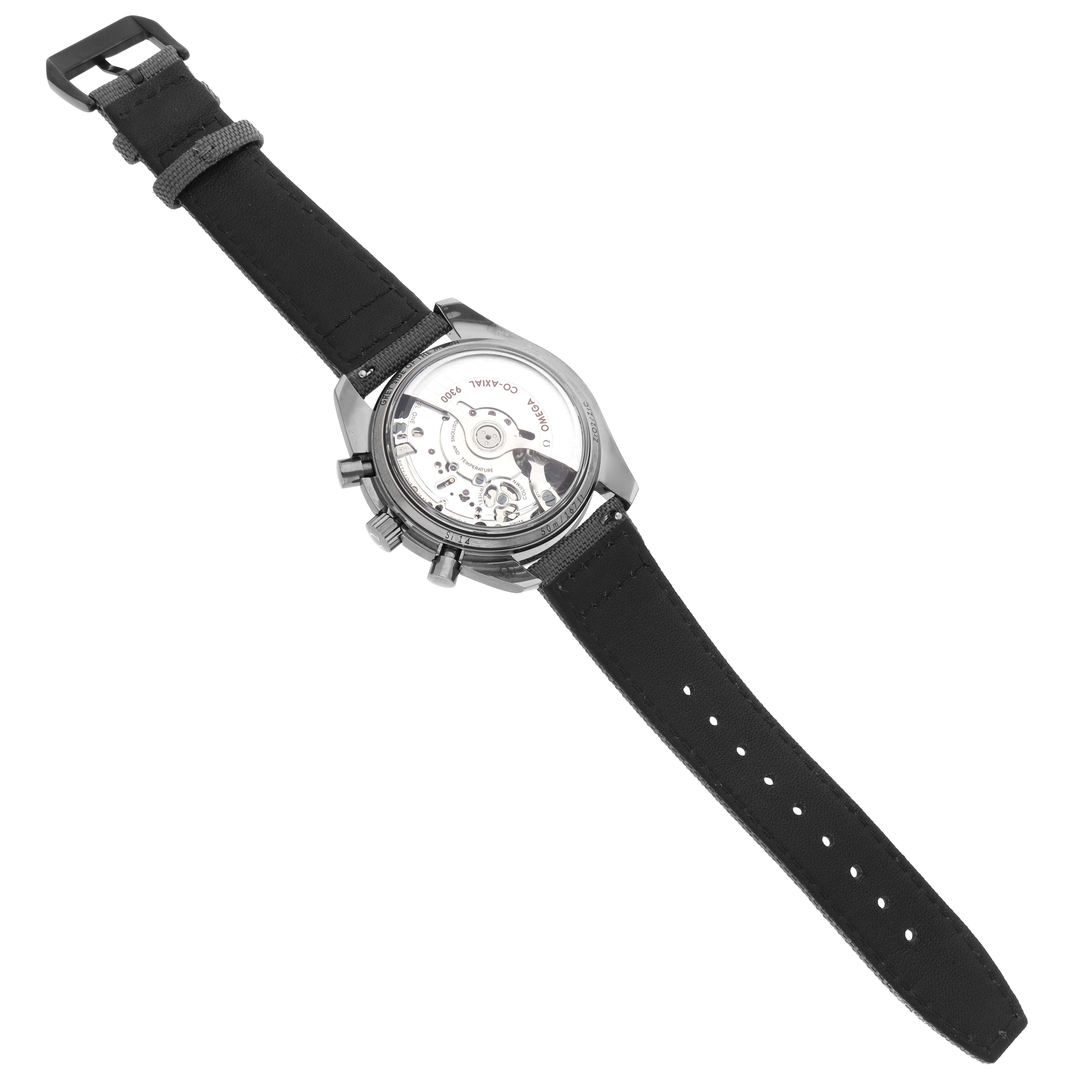 The Omega Speedmaster 311.93.44.51.99.002 Men's Ceramic Silver Dial is shown from the back, displaying its transparent case back and movement, with a black strap visible.