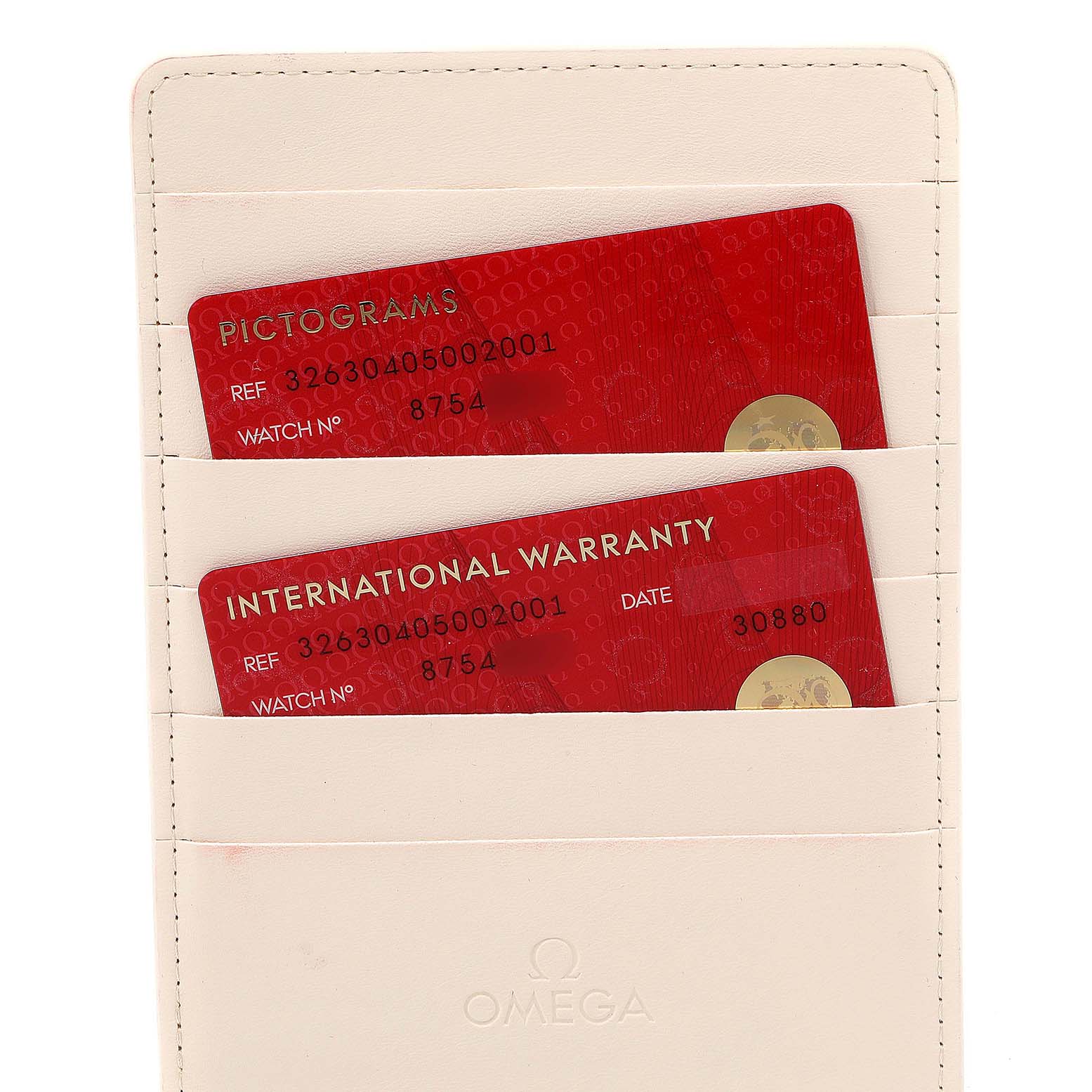 The image shows warranty and pictograms cards for the Omega Speedmaster 326.30.40.50.02.001  Men
s Stainless Steel Silver Dial 326.30.40.50.02.001  Men
s Stainless Steel Silver Dial model placed in a white cardholder.