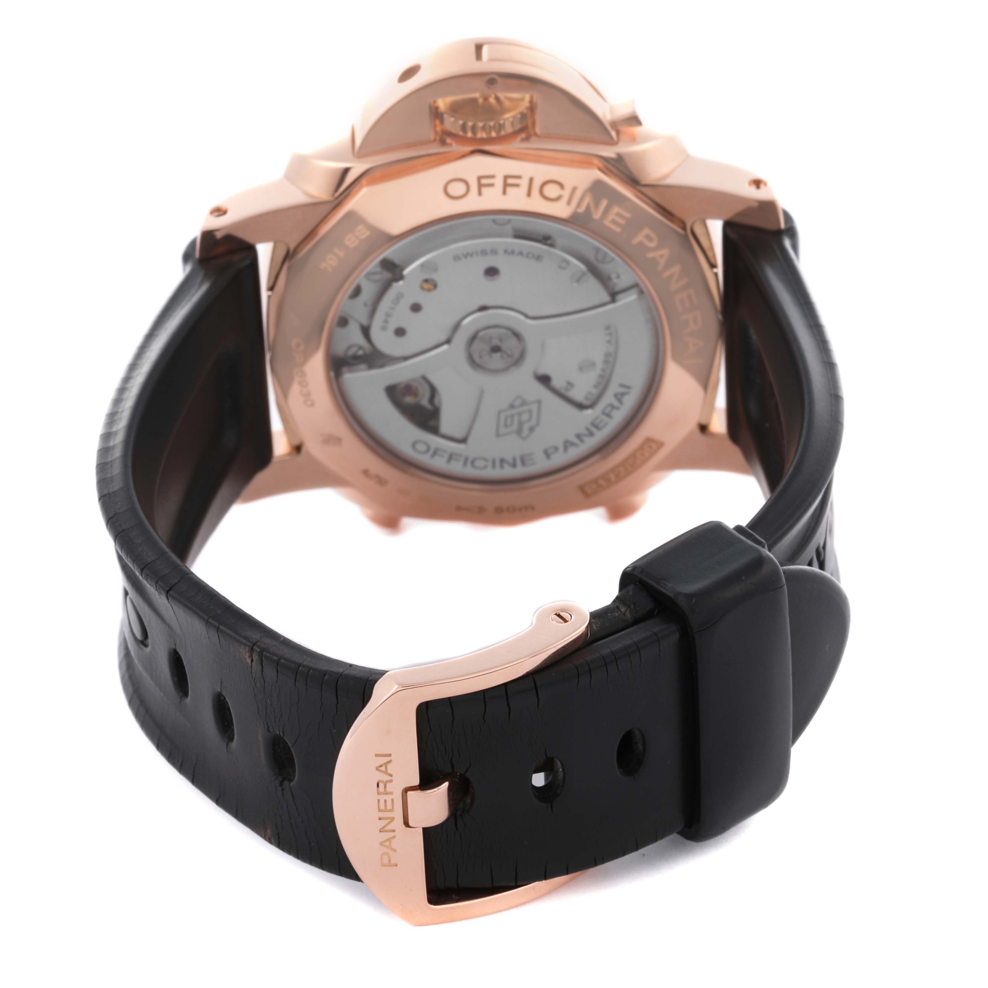 The image shows the back of a Panerai Luminor PAM00525 Men's Rose Gold Black Dial PAM00525 Men's Rose Gold Black Dial watch, highlighting the case back, movement, and leather strap with a branded clasp.