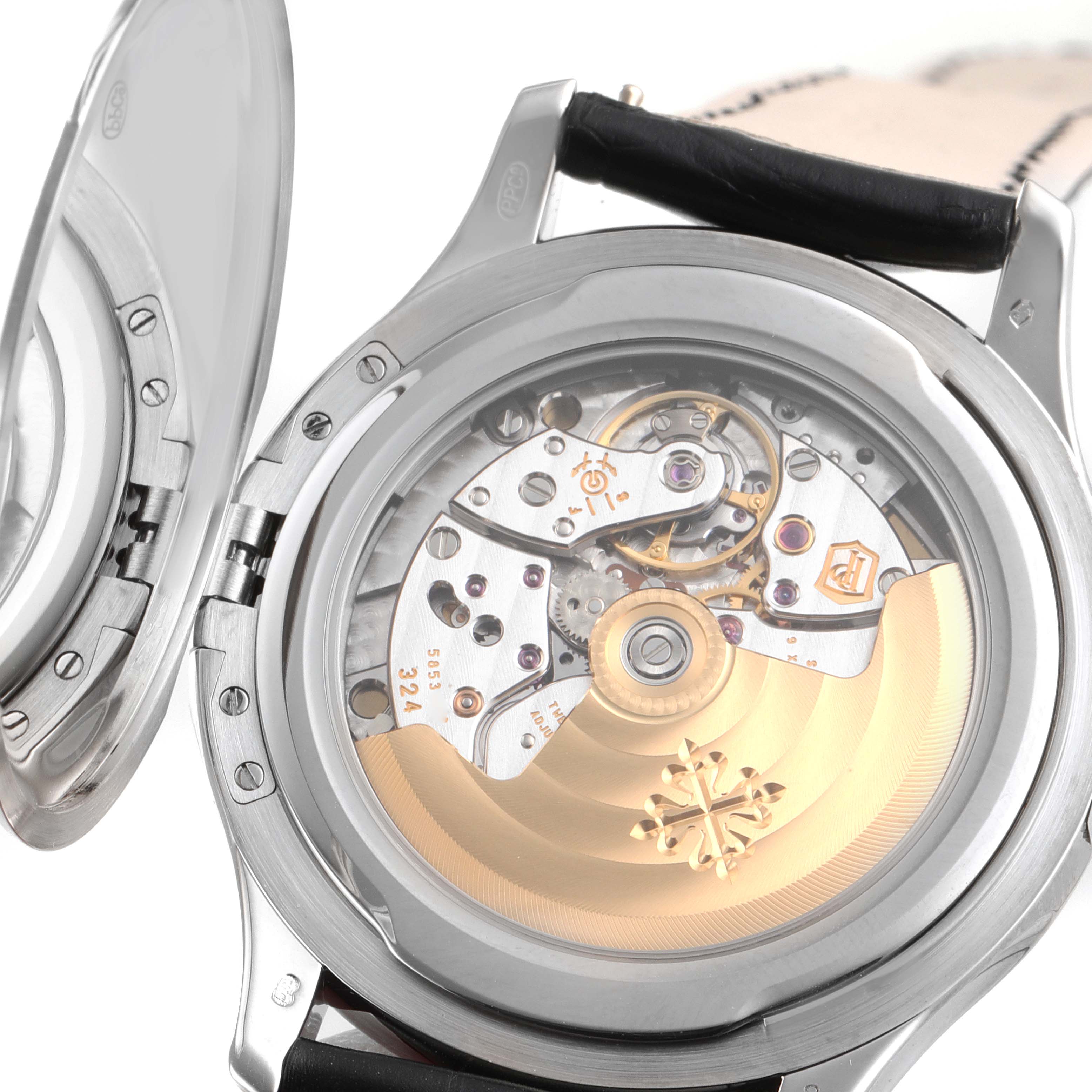 This image shows the open back of a Patek Philippe Calatrava 5227G Men's White Gold Silver Dial 5227G Men's White Gold Silver Dial watch, revealing its intricate mechanical movement.
