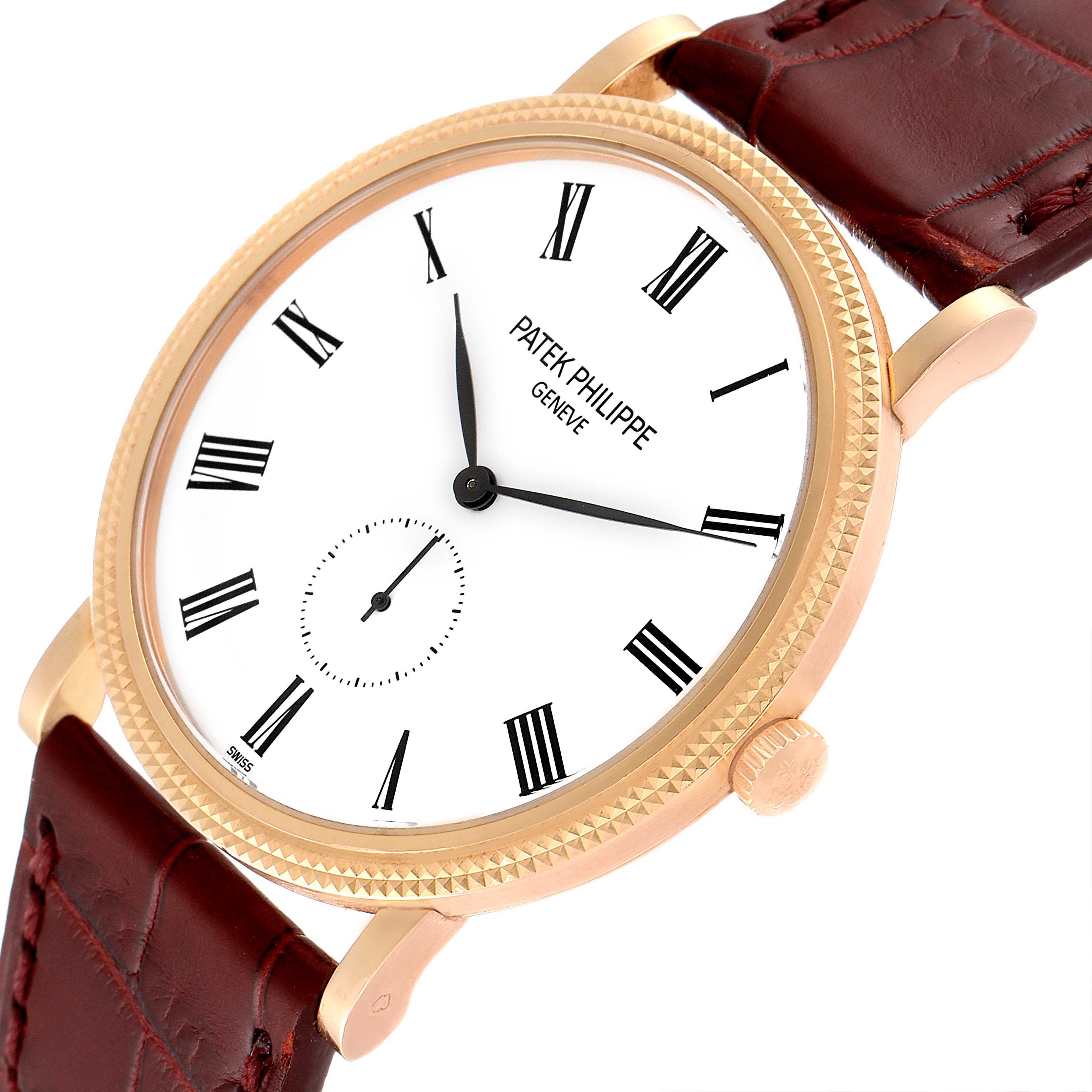 This image shows a close-up, angled view of the dial, case, crown, and part of the strap of the Patek Philippe Calatrava 5119R Men's Rose Gold White Dial 5119R Men's Rose Gold White Dial watch.