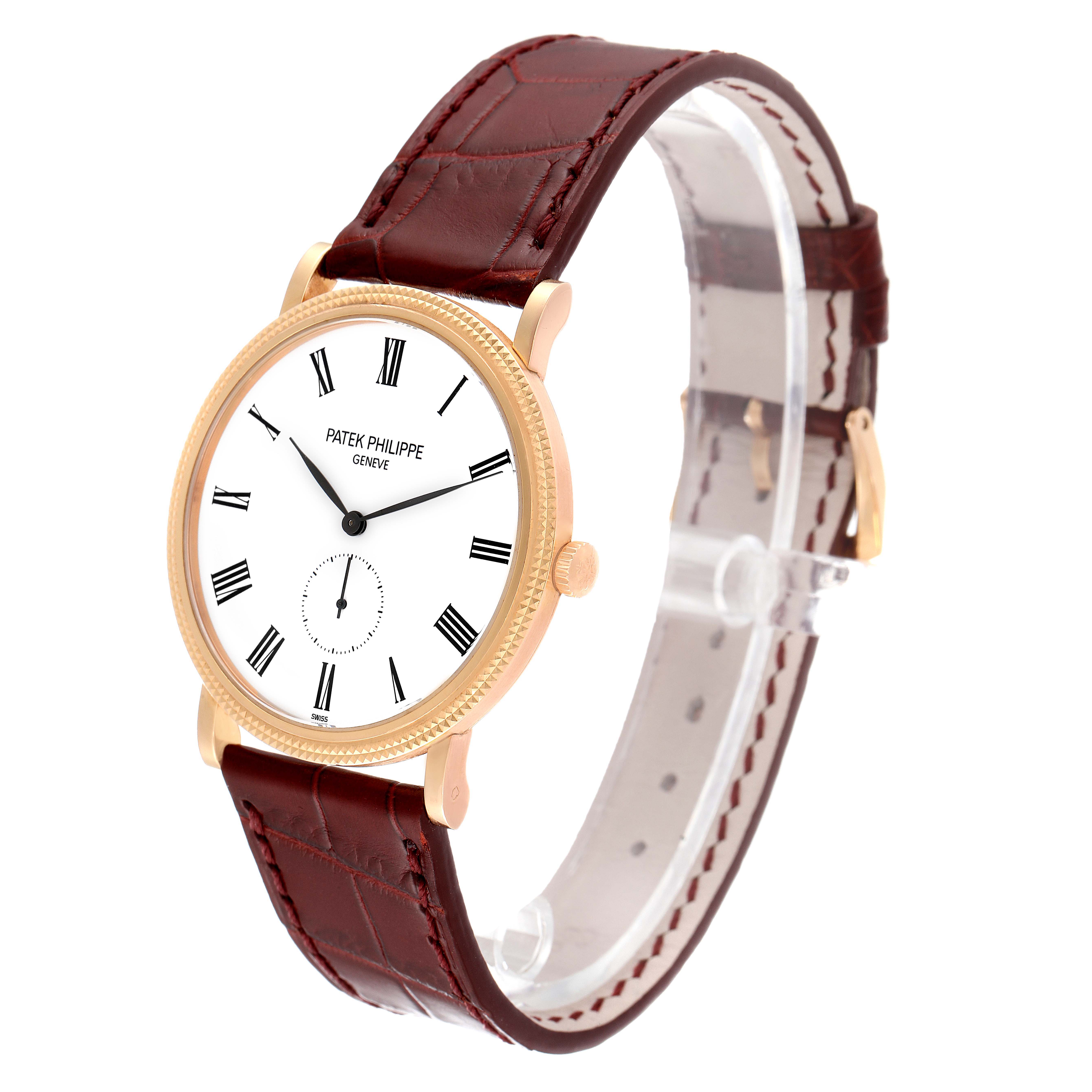 This Patek Philippe Calatrava 5119R Men's Rose Gold White Dial 5119R Men's Rose Gold White Dial watch is shown at a slight angle, displaying the face, crown, and leather strap.