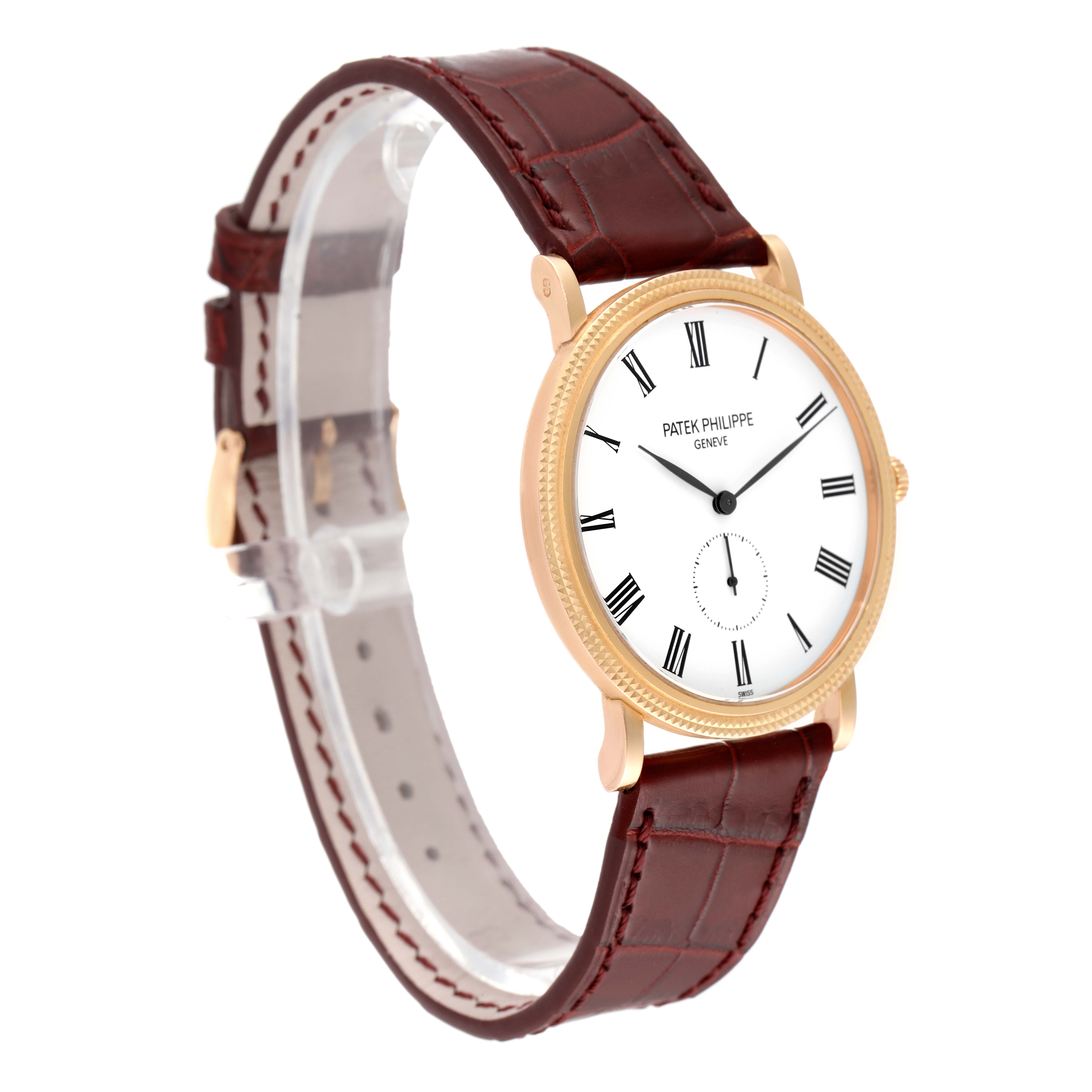 The image shows a side angle of the Patek Philippe Calatrava 5119R Men's Rose Gold White Dial 5119R Men's Rose Gold White Dial watch, featuring its dial, case, crown, and leather strap.