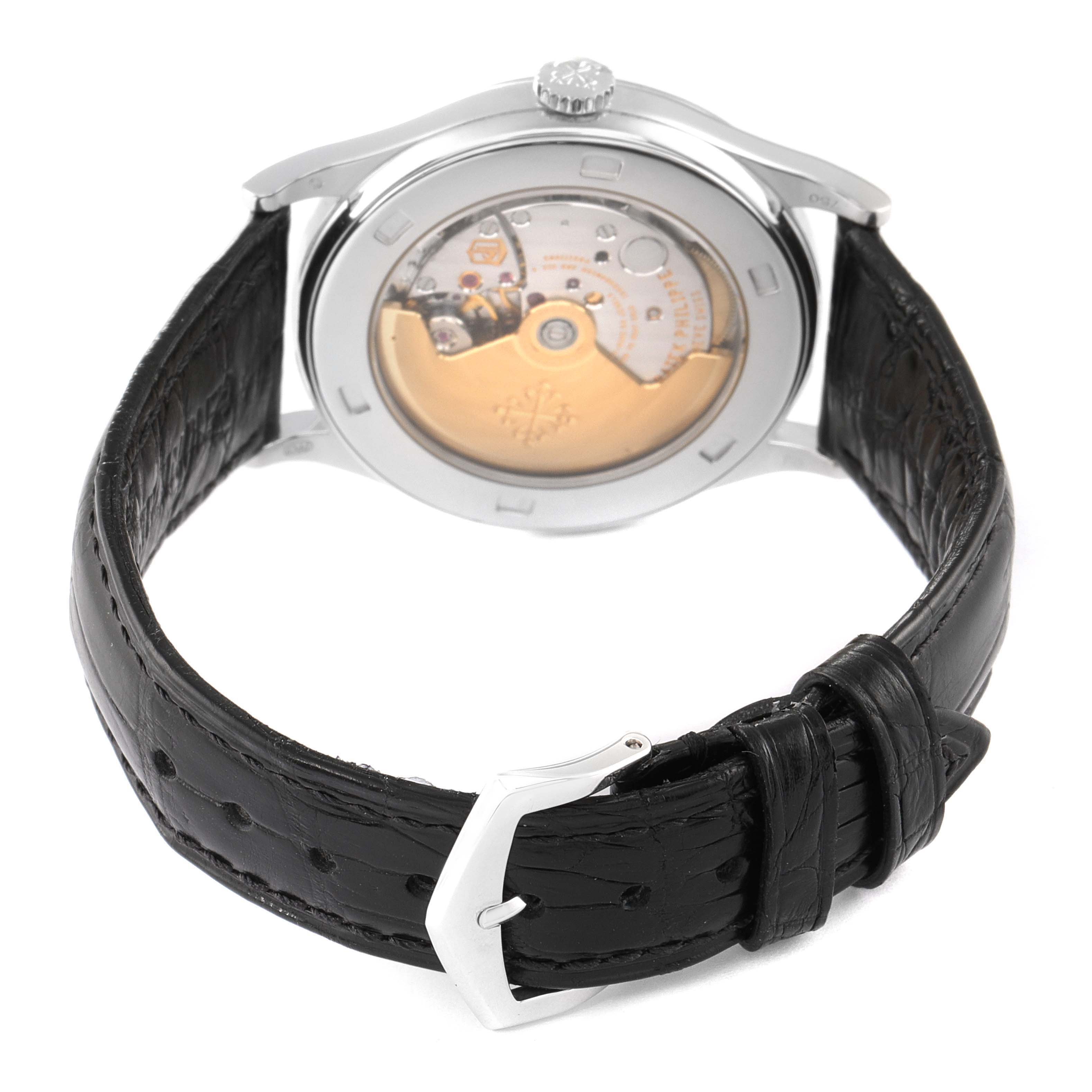 This image shows the back view of a Patek Philippe Calatrava 5297G Men's White Gold Black Dial 5297G Men's White Gold Black Dial watch, highlighting the movement and leather strap.