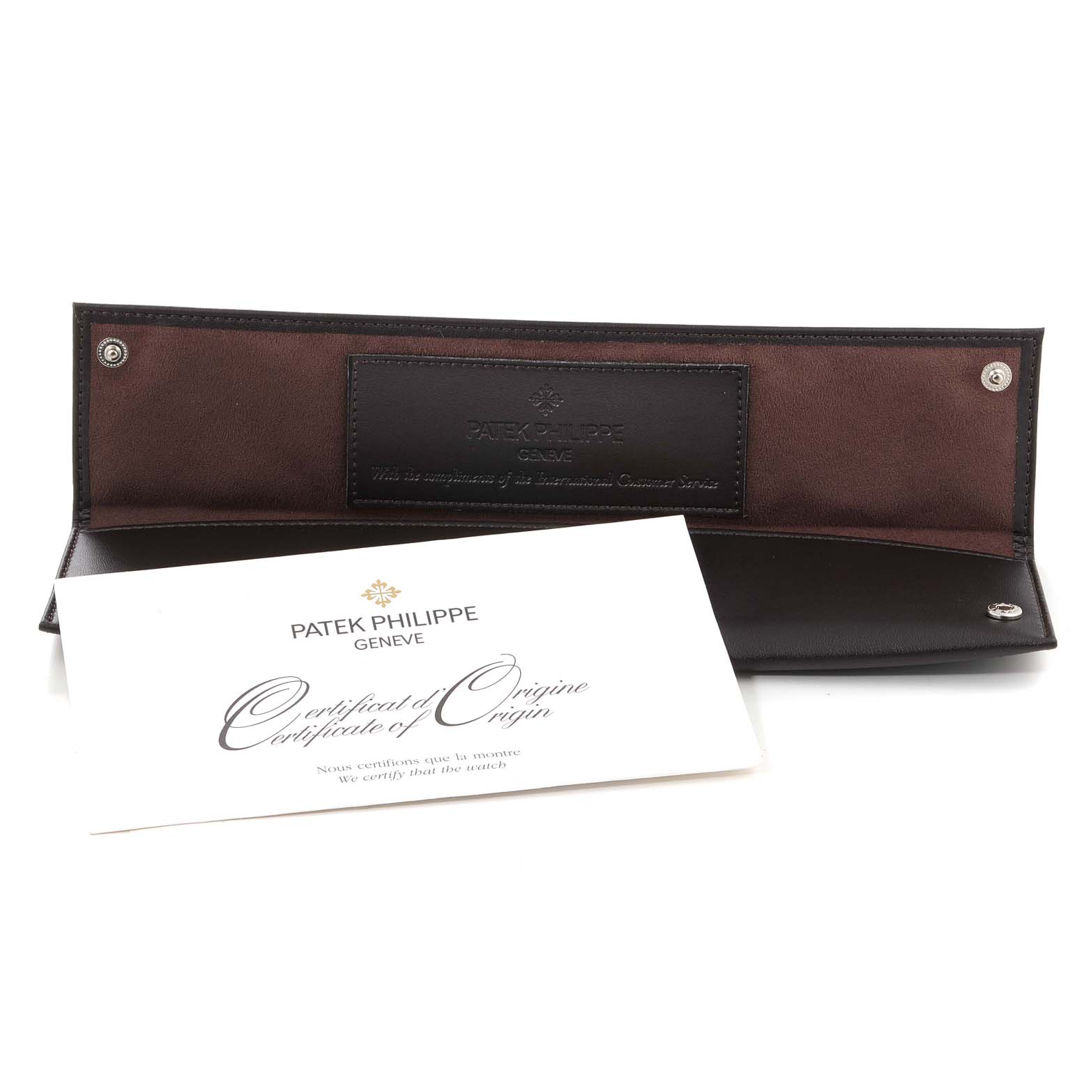 The image shows a Patek Philippe Calatrava 5297G Men's White Gold Black Dial 5297G Men's White Gold Black Dial watch's certificate of origin and its opened leather case.