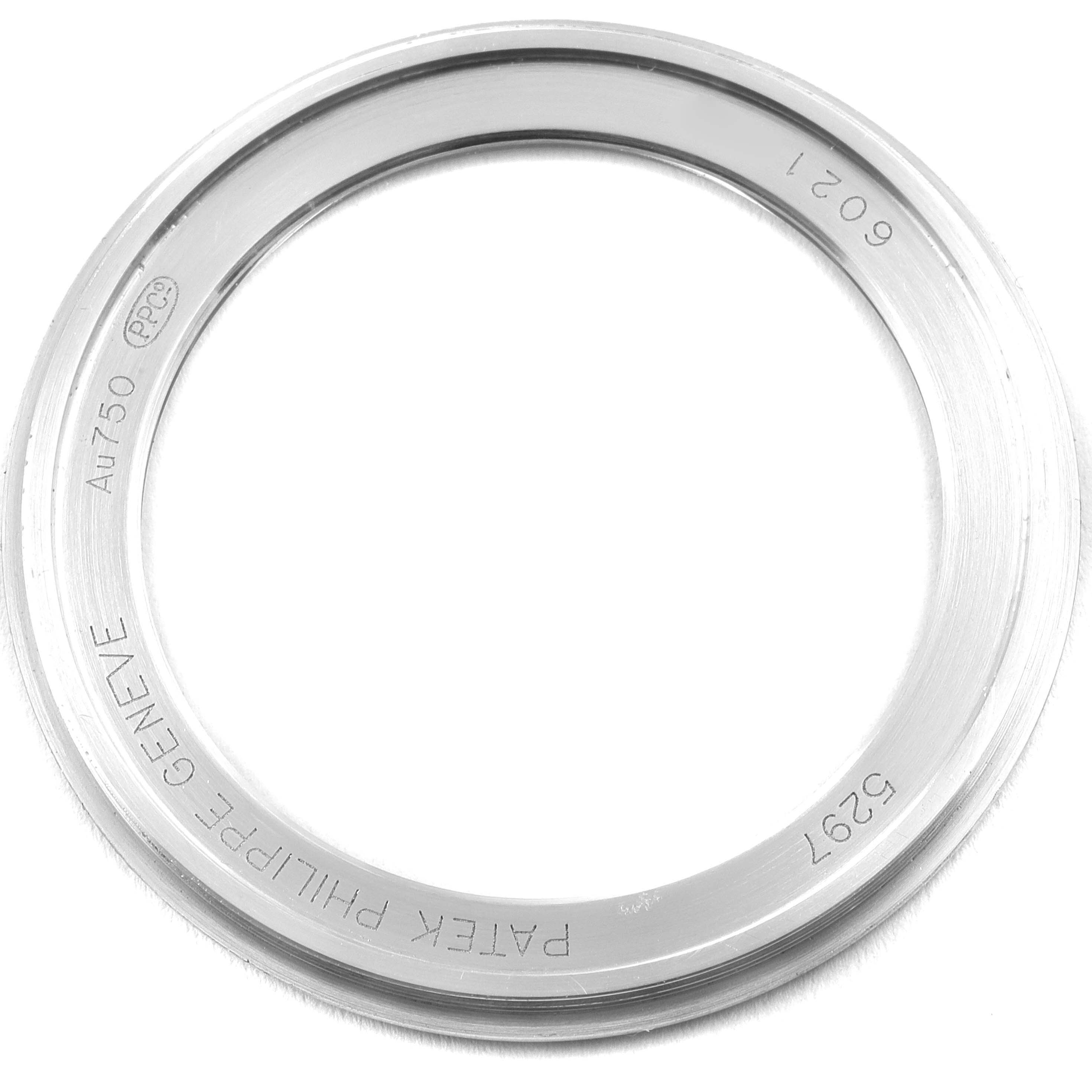 This image shows the bezel from a Patek Philippe Calatrava 5297G Men's White Gold Black Dial 5297G Men's White Gold Black Dial watch, displayed from a top-down perspective.