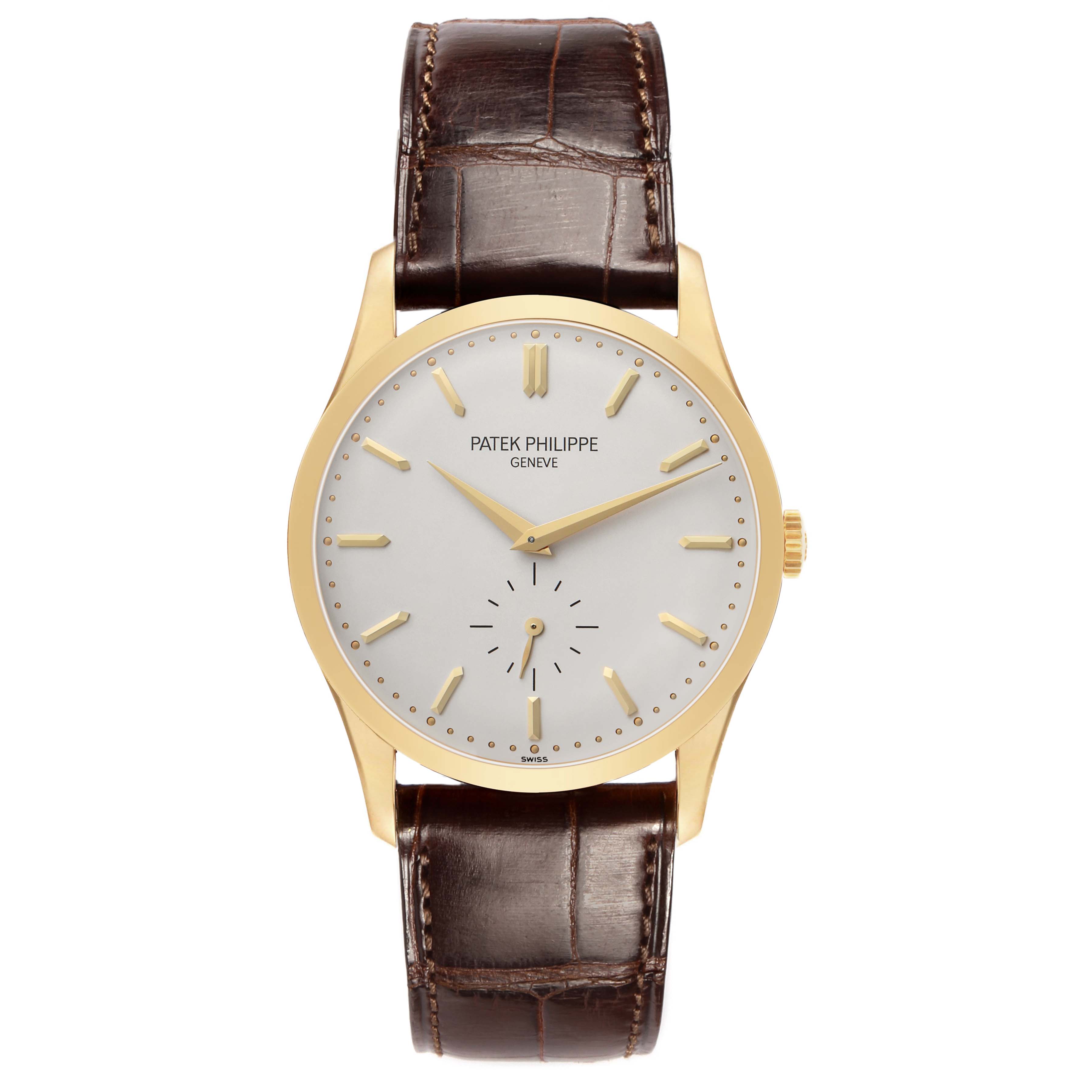 The Patek Philippe Calatrava 5196J Men's Yellow Gold Silver Dial is shown from a top-down angle, displaying its dial, markers, hands, and brown leather strap.