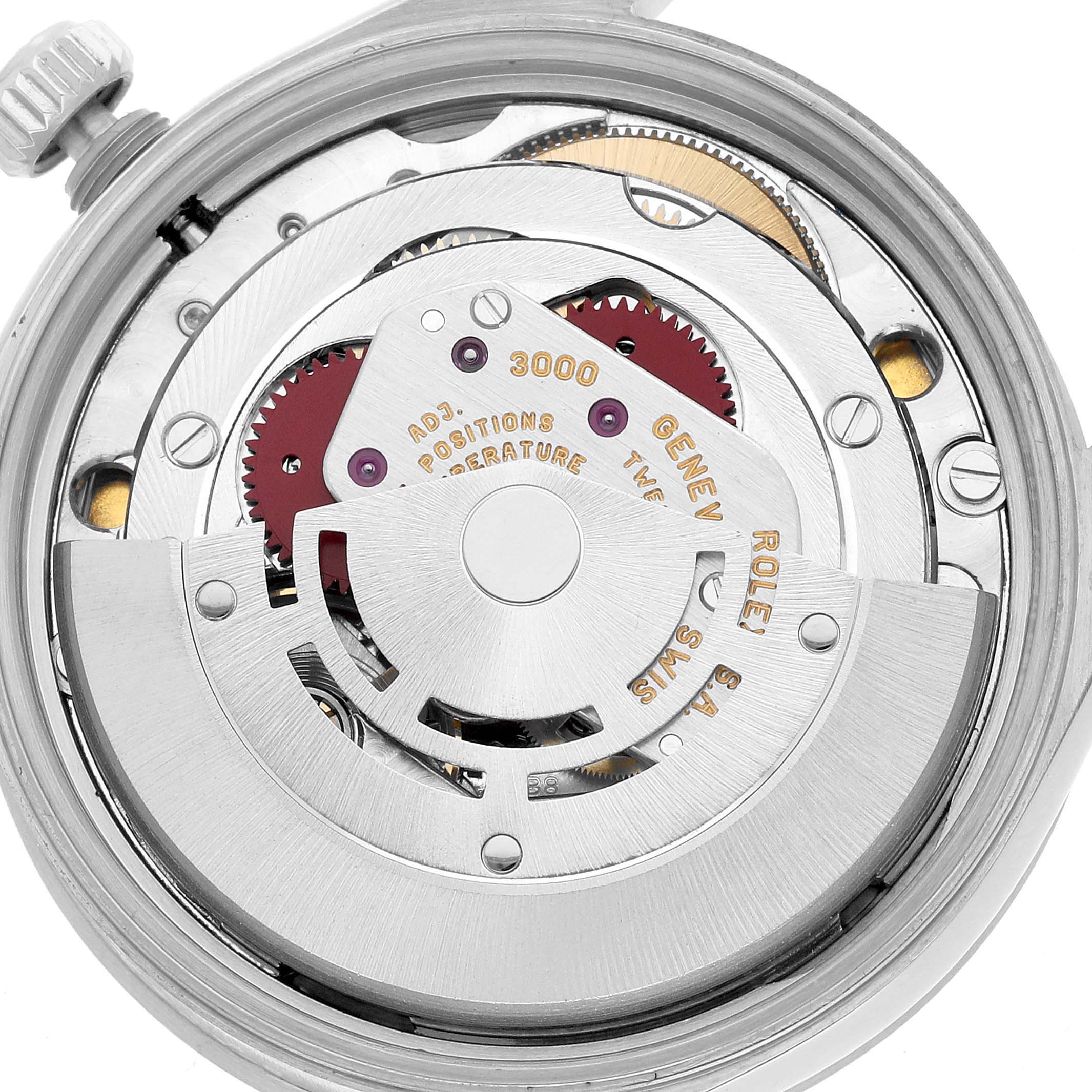The image shows the movement of a Rolex Air-King 14010 Men's Stainless Steel White Dial from a top-down angle, highlighting the rotor and gears.