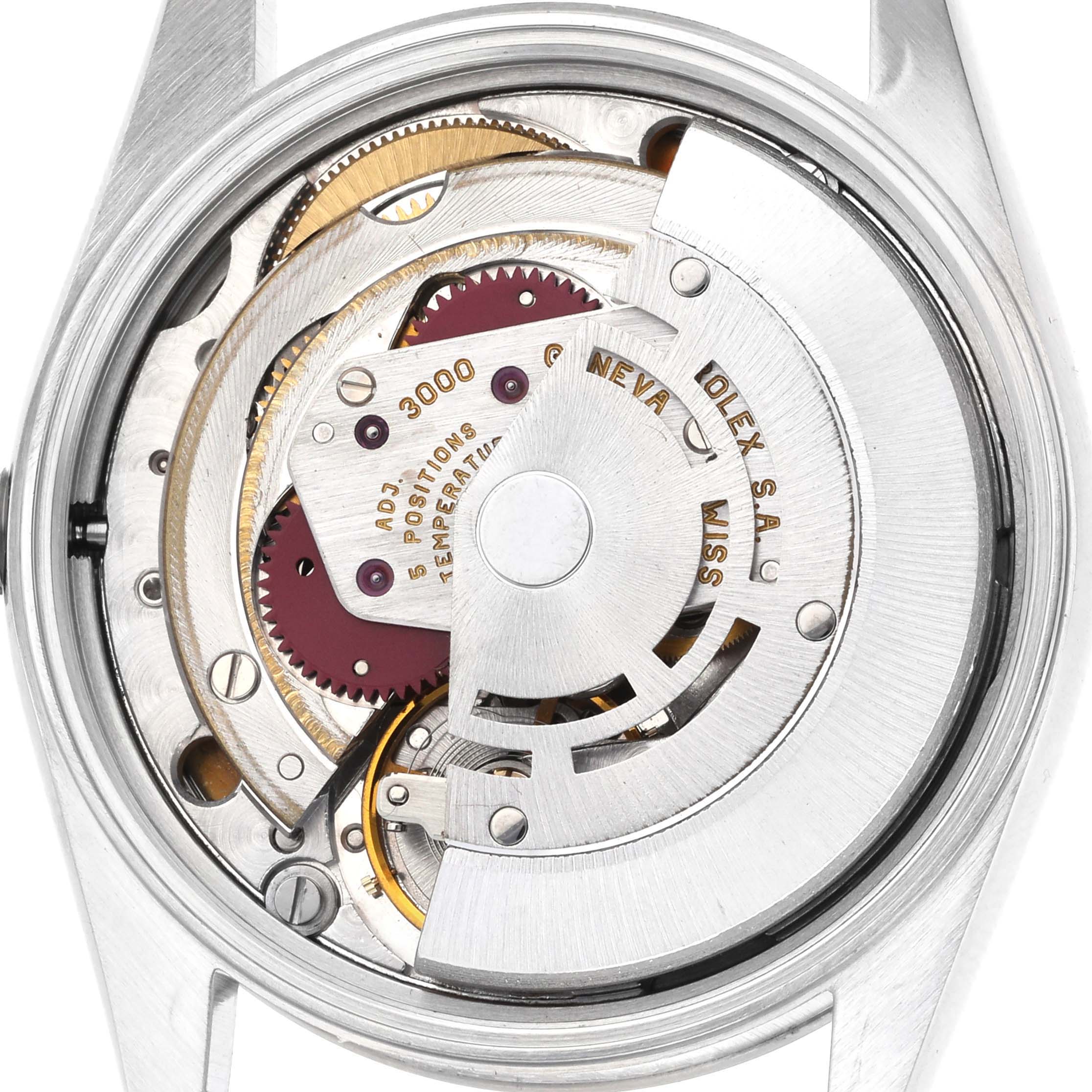 The image shows the movement of a Rolex Air-King 14000 Men's Stainless Steel Blue Dial watch viewed from the back, highlighting its intricate internal mechanics.