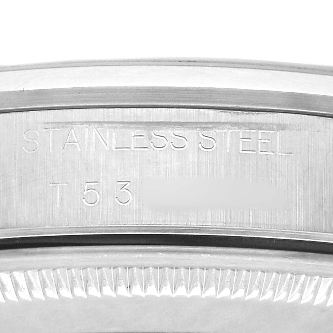 The image shows a close-up of the stainless steel case back of a Rolex Air-King 14000 Men's Stainless Steel Blue Dial watch, highlighting the engravings.