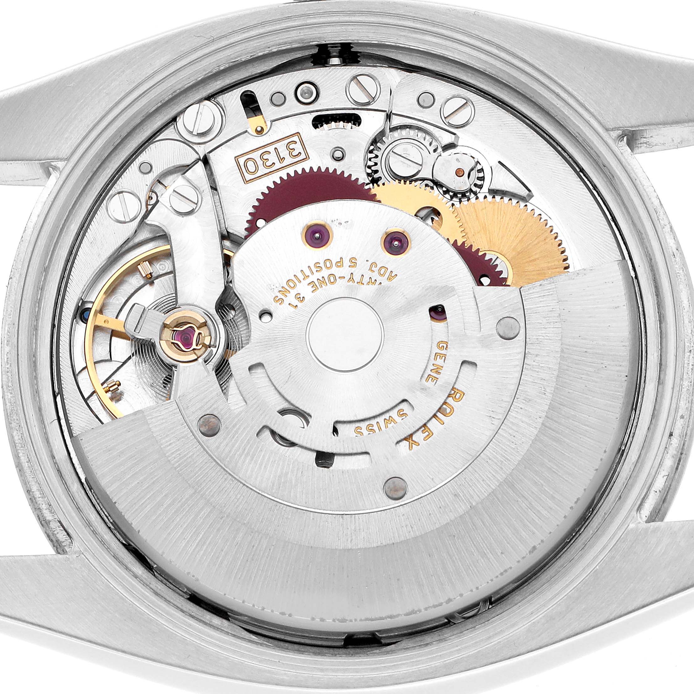 The image shows the internal movement mechanism of a Rolex Air-King 114200 Men's Stainless Steel Silver Dial watch from a top view.