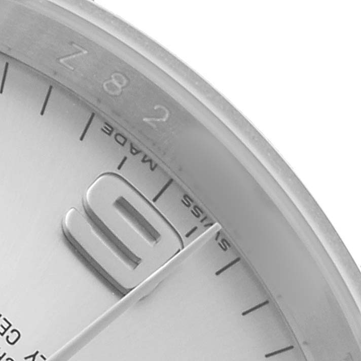 The image shows a close-up of the Rolex Air-King 114200 Men's Stainless Steel Silver Dial watch face, focusing on the numeral "9" and the "Swiss Made" text.