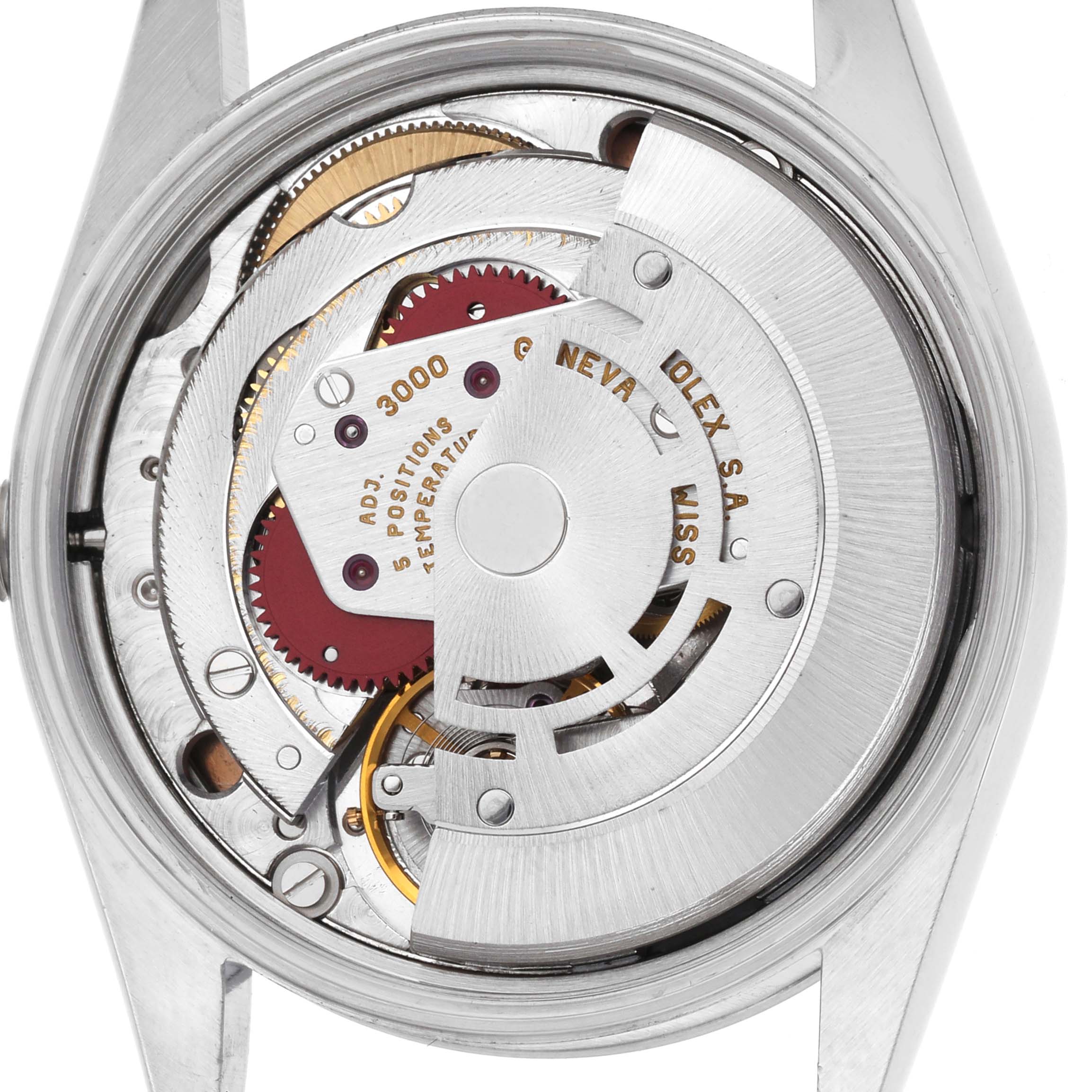 The image shows the movement of a Rolex Air-King 14000 Men's Stainless Steel Pink Dial watch from the back, highlighting the rotor and mechanical parts.